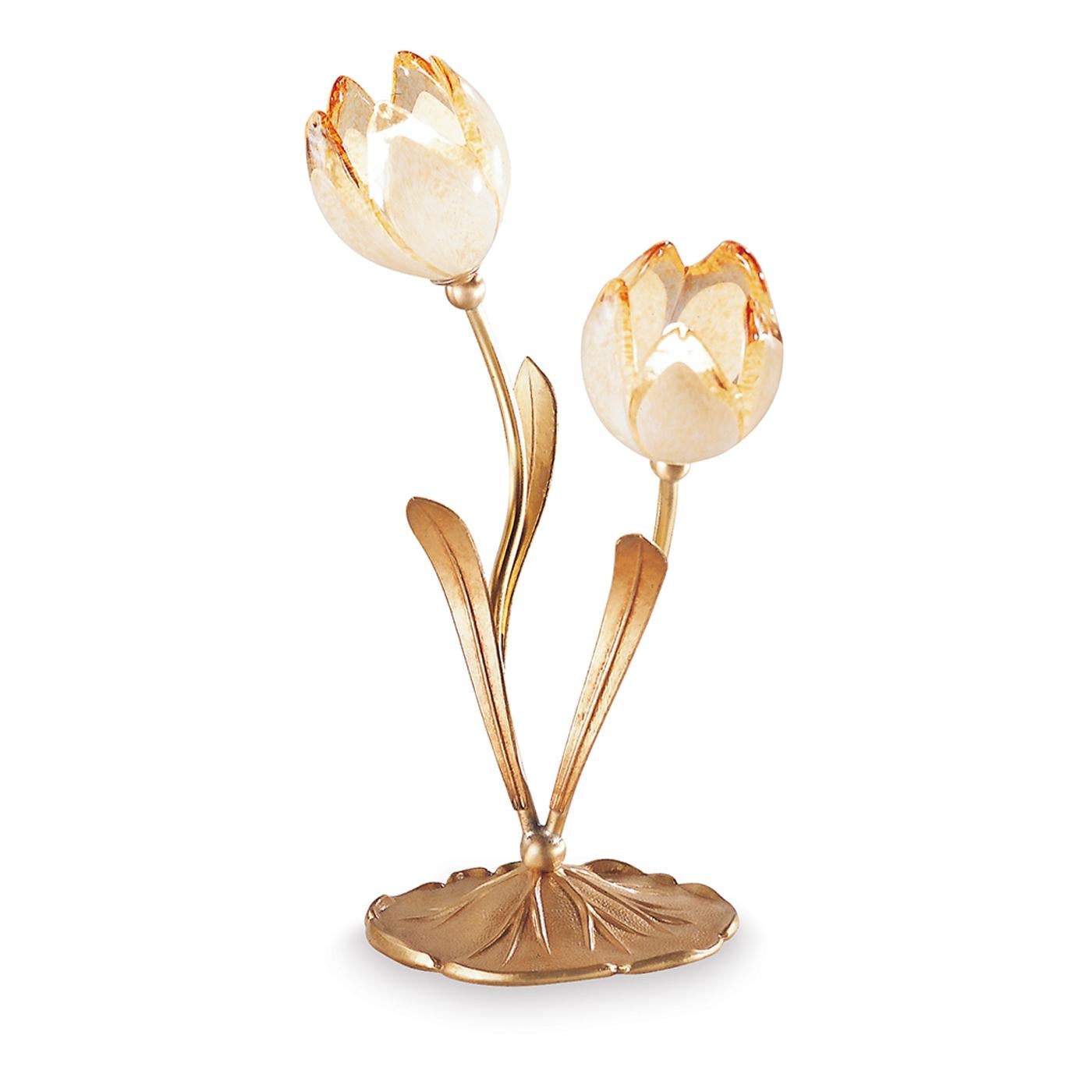 Romantic in its silhouette, recreating a couple of tulips in bloom, this table lamp is an ode to nature enhanced by the luxury of precious finishes and materials. The leafed stems sinuously extend from the textured scalloped base up to bud-shaped