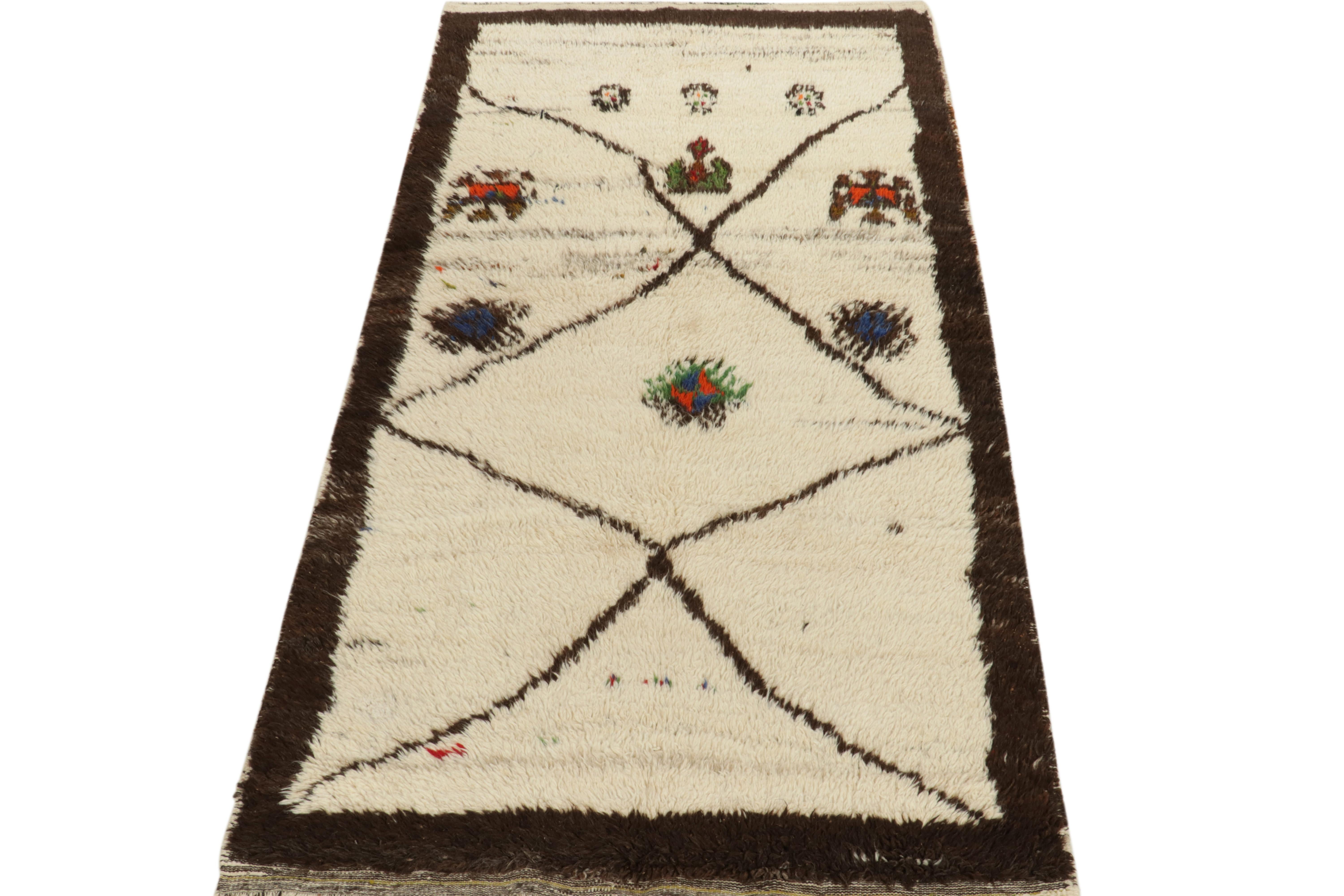 This vintage 4×8 Tulu rug is a new addition to Rug & Kilim’s mid-century tribal curations. Hand-knotted in wool, it originates from Turkey circa 1950-1960.

This provenance is known for thick, lush pile and archaic designs like this rug’s play of