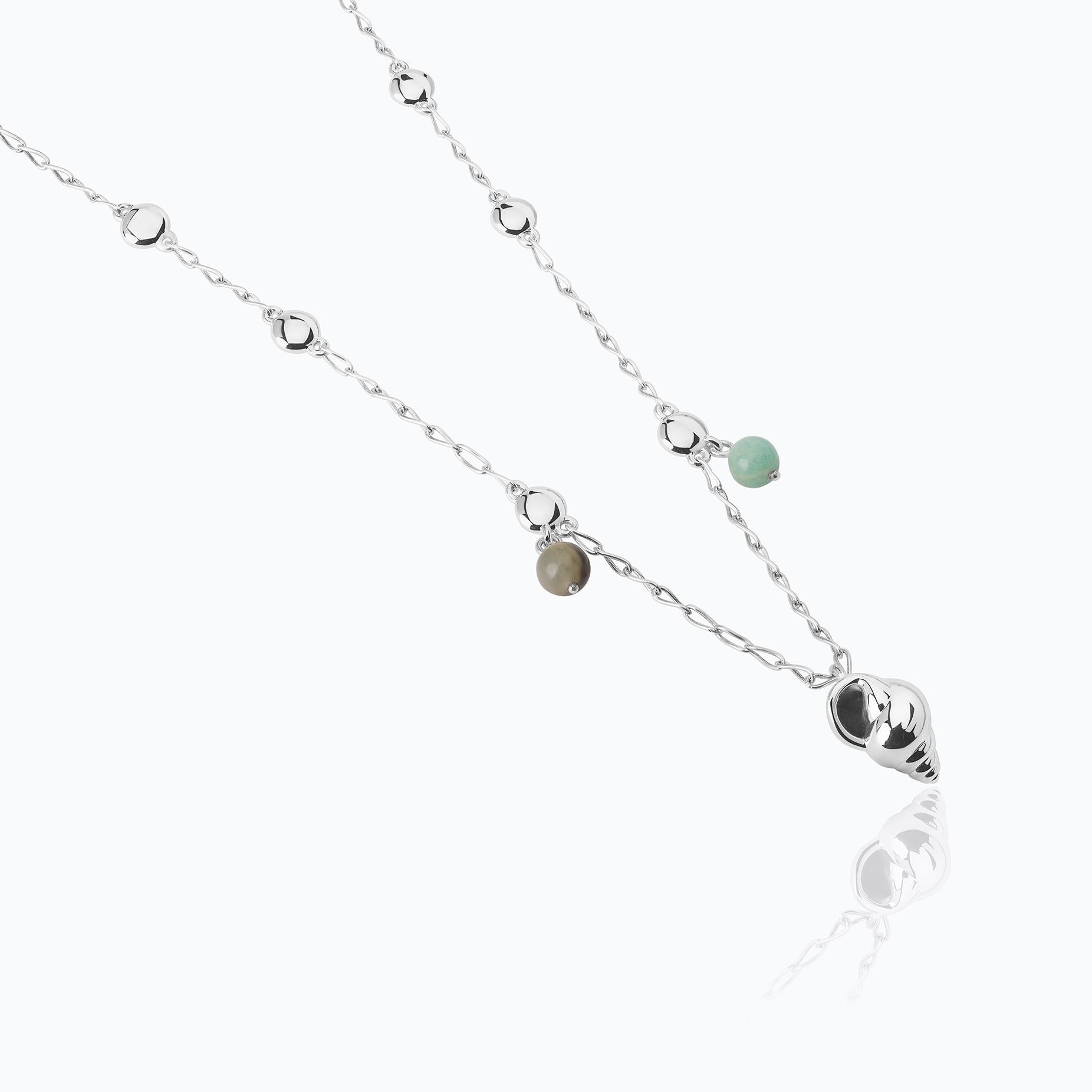 The Tulum Necklace is made of .925 silver with natural stones, Amazonite and Green Jasper. Inspired by the days of sun and sand on the beaches of Mexico, the necklace is made up of a chain decorated with natural stones, and a pendant with exquisite