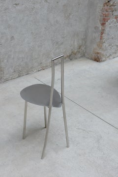"Tumble" Chair in stainless steel tube and polished seat.