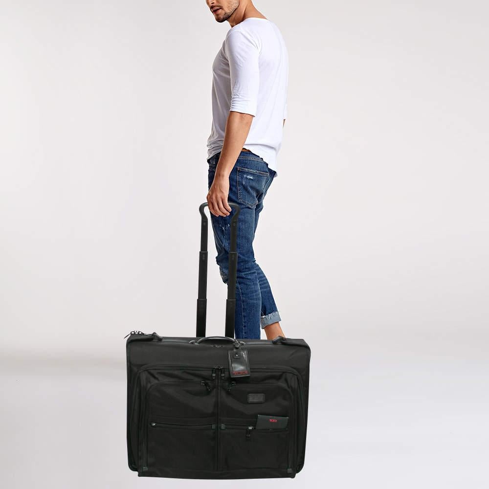 Embark on your journeys with this TUMI luggage bag  designed to accompany you in style and sophistication. Its sleek silhouette and elegant design make a statement wherever you travel.