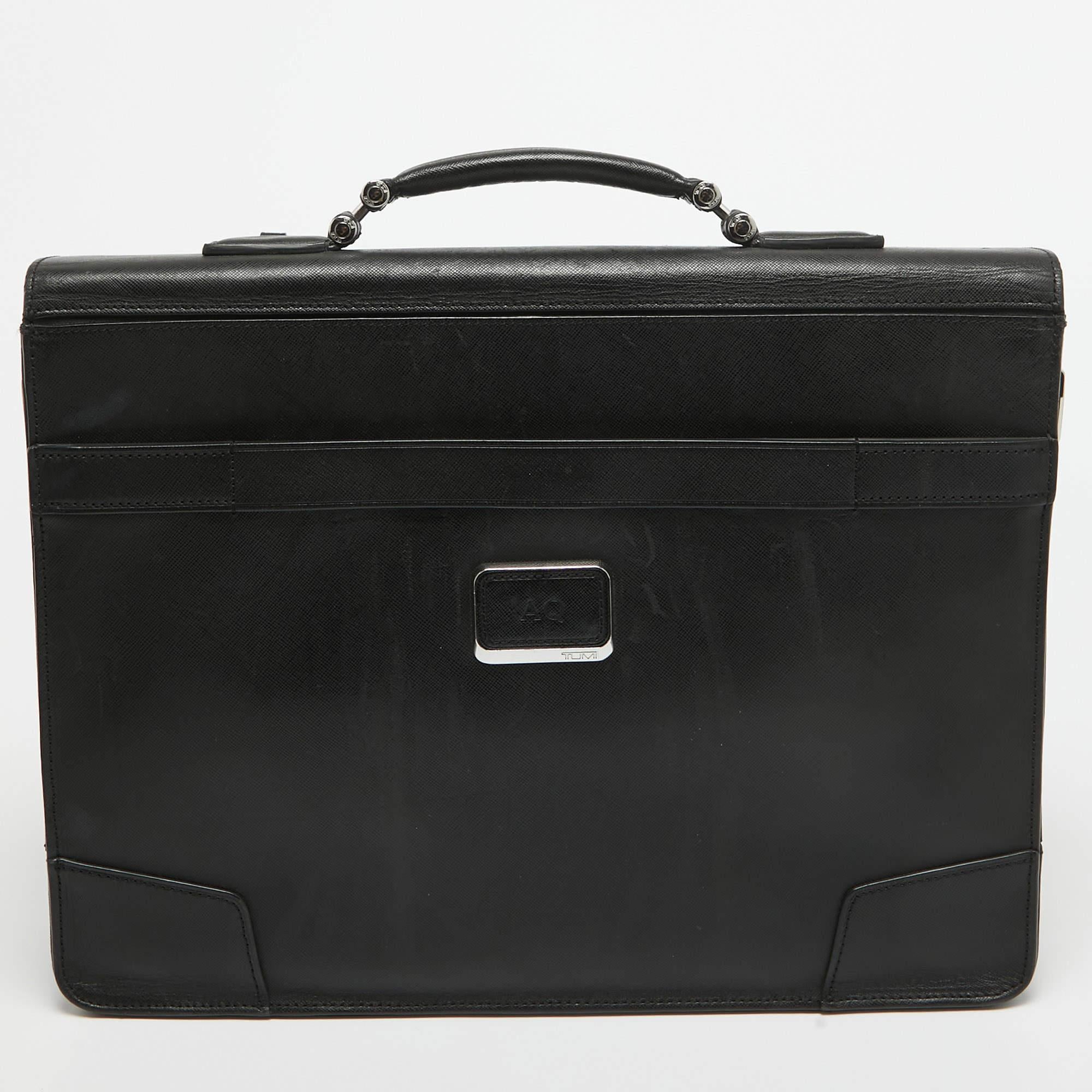 Elevate your style with this TUMI briefcase. Merging form and function, this exquisite accessory epitomizes sophistication, ensuring you stand out with elegance and practicality by your side.

Includes: Detachable Strap