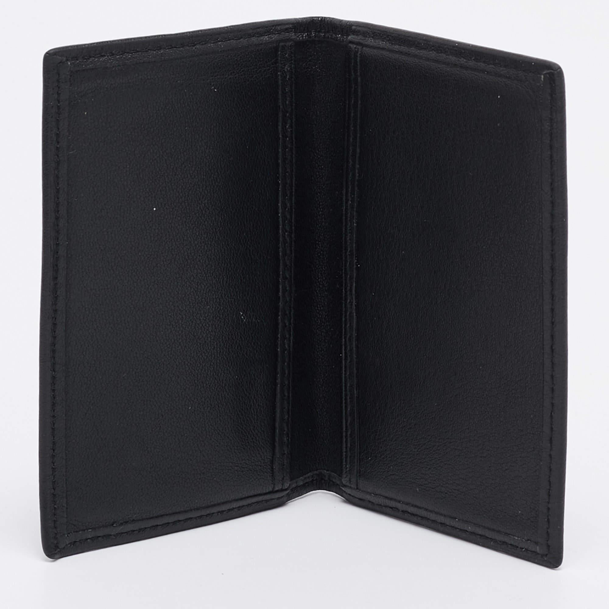 This stylish and functional cardholder is a must have in your collection. It is equipped with multiple well lined slots to hold your cards.