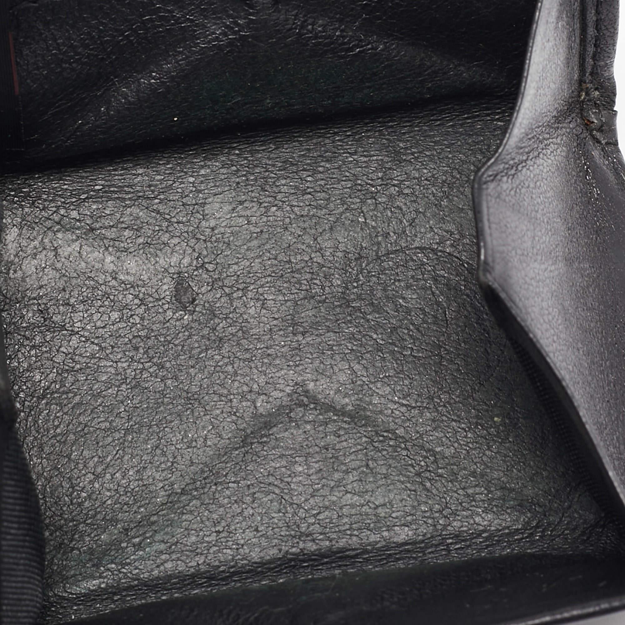 Crafted using leather this TUMI coin purse will help carry your coins and other little essentials with ease. It comes in a classy balck hue and is lined with leather.