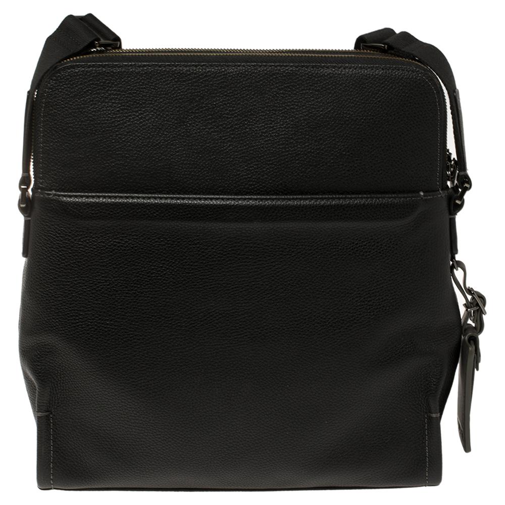 An accessory of practical style, this black crossbody bag from TUMI will be a delight to own. It is crafted from leather and features a nylon compartment and pockets. Complete with a shoulder strap, you can carry this bag on any day.

Includes:Price