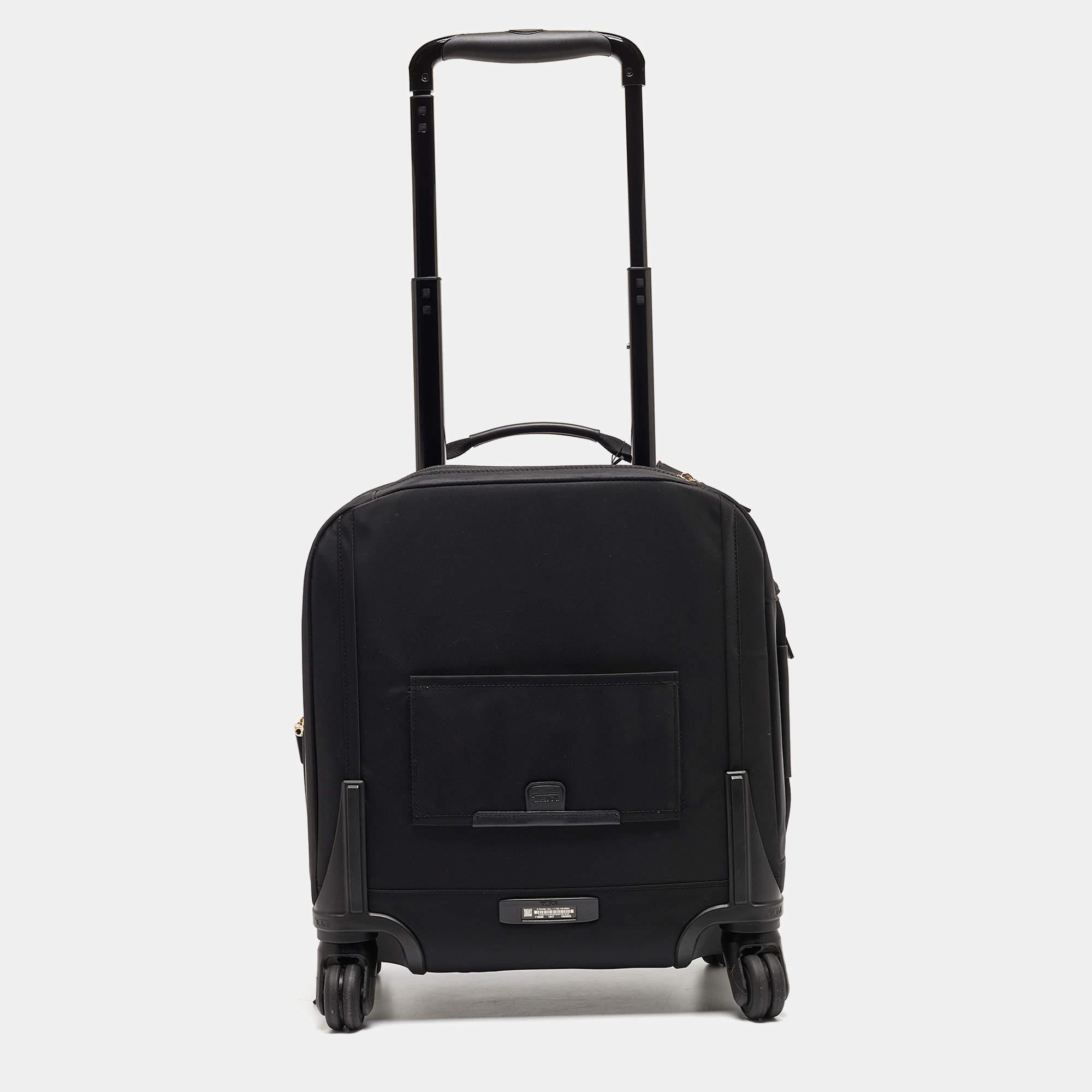 Crafted for the discerning traveler, the TUMI luggage embodies practicality and style. Made from durable nylon, it offers ample space for essentials without compromising on sleekness. With its compact design and thoughtful features, it's a