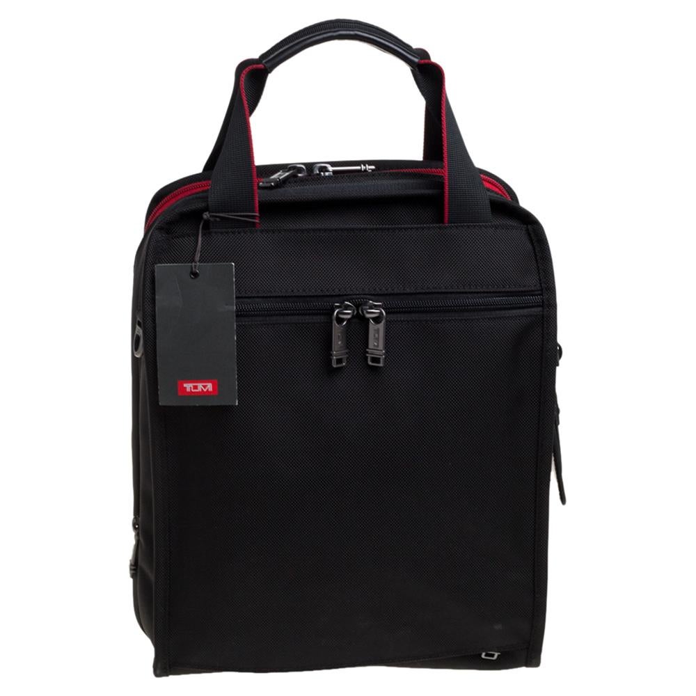 The DFO Utility design by TUMI is an ultra-functional choice to carry your essentials! Crafted using nylon, the tote is perfect for frequent use. It includes pockets, a main nylon compartment, two top handles, and an adjustable shoulder