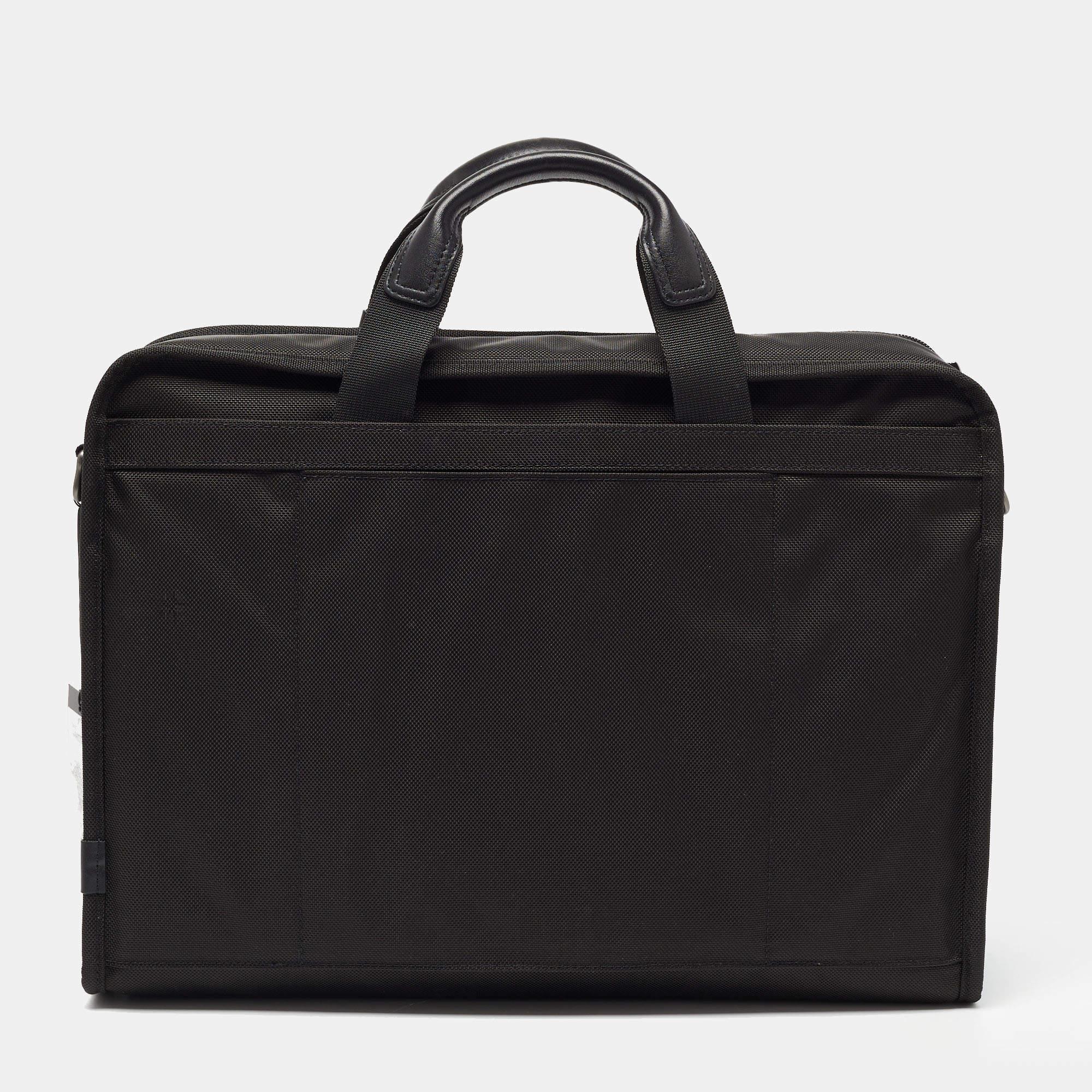 Perfect for housing your documents and other work essentials, this briefcase will make an elegant choice. Crafted with function in mind, this bag features a central capacious interior.

Includes: info card, Leather Name Tag, Detachable Strap, Brand