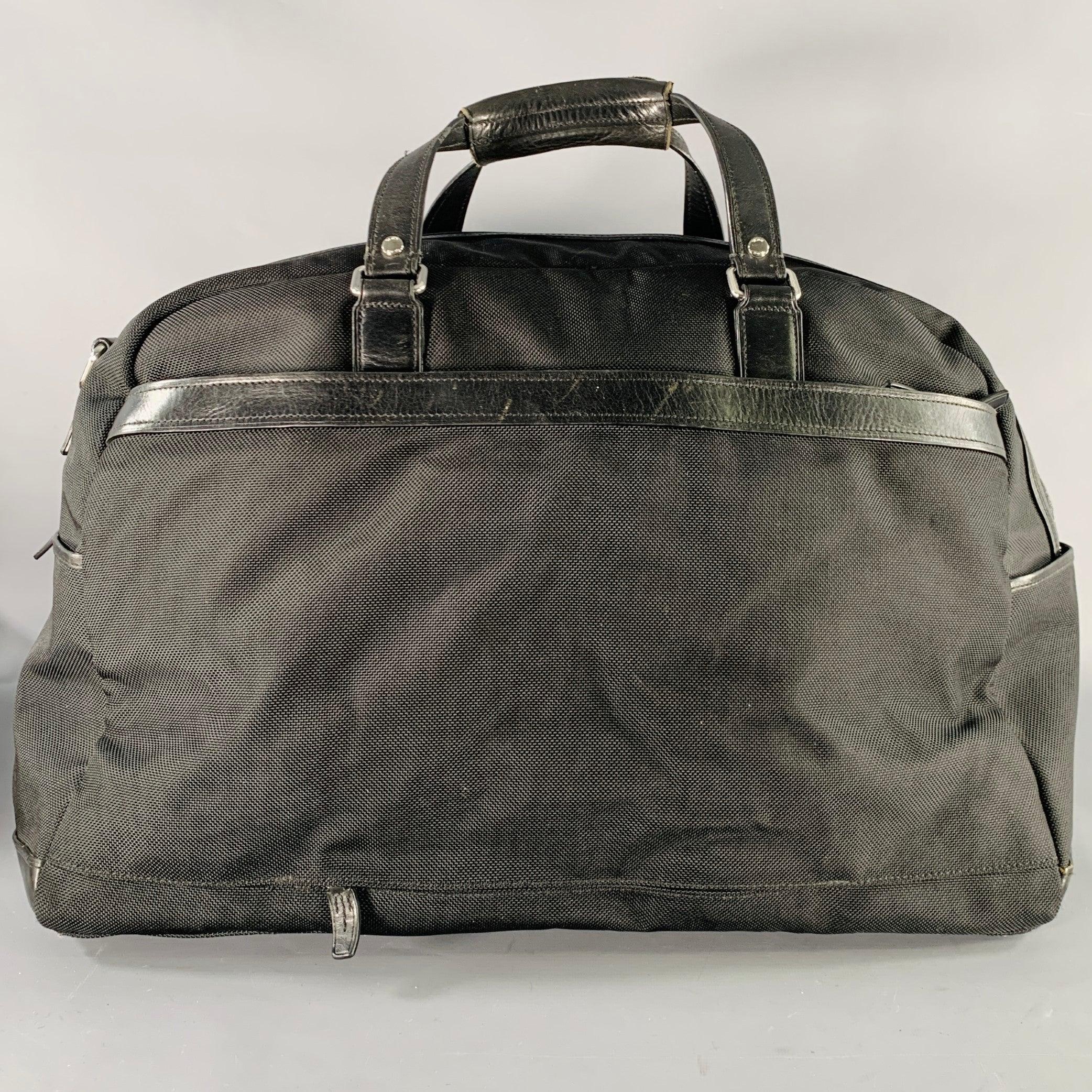 TUMI Bolsa de viaje con asas superiores de piel y nylon negro Negro en venta