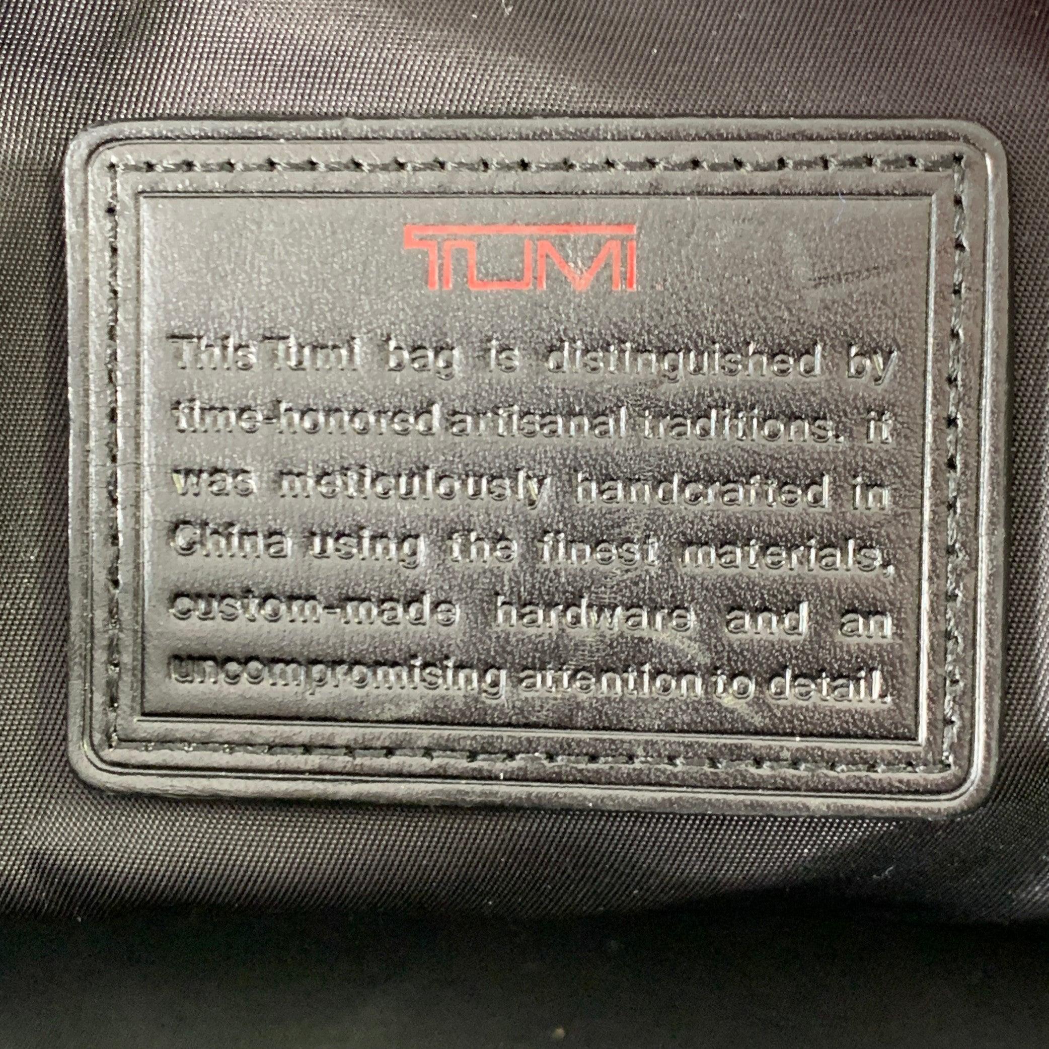 TUMI Bolsa de viaje con asas superiores de piel y nylon negro en venta 3