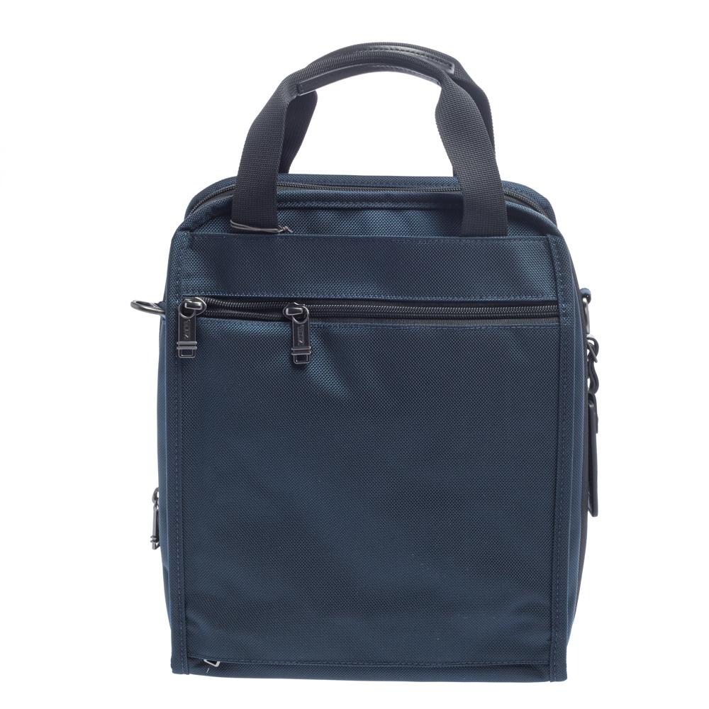 The Utility design by TUMI is an ultra-functional choice to carry your essentials! Crafted using nylon and leather, the tote is perfect for frequent use. It includes exterior pockets, a main nylon compartment, two top handles, and an adjustable