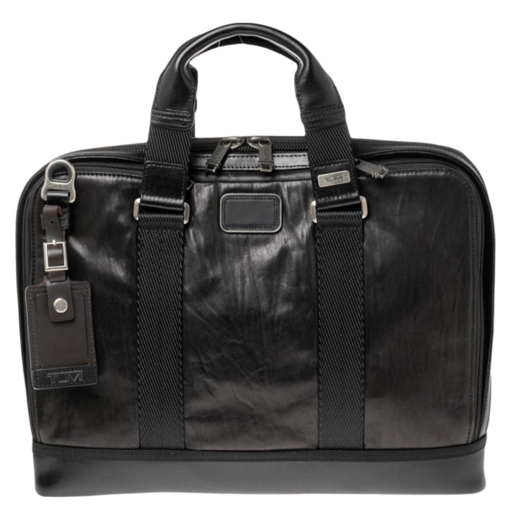 The Alpha Bravo design from Tumi is truly the alpha of all bags! Crafted with brown leather, the Andrew slim briefcase is perfect for organizing. It includes two top handles and a shoulder strap. Aside from the separate laptop compartment, the