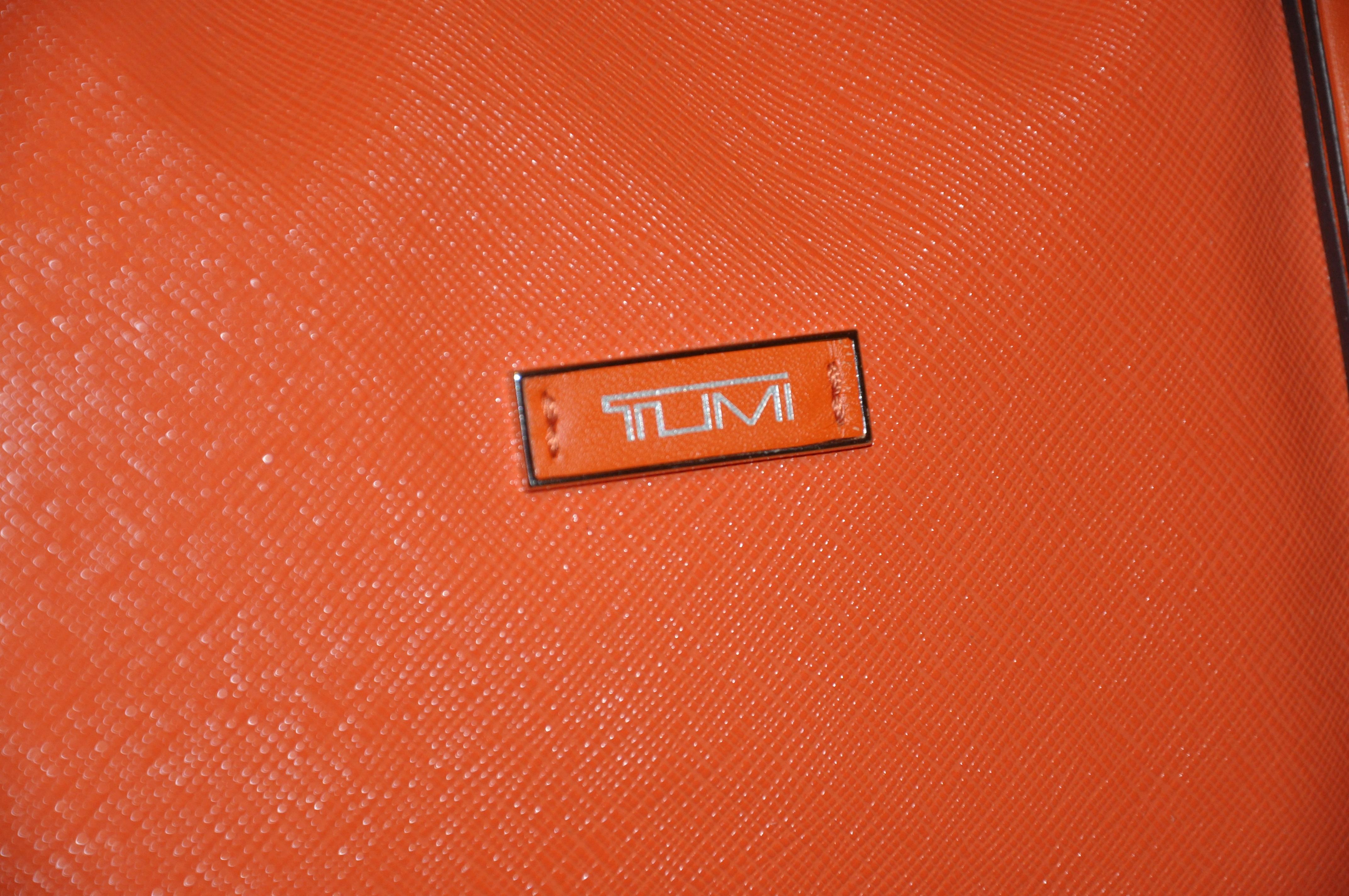 tumi orange bag
