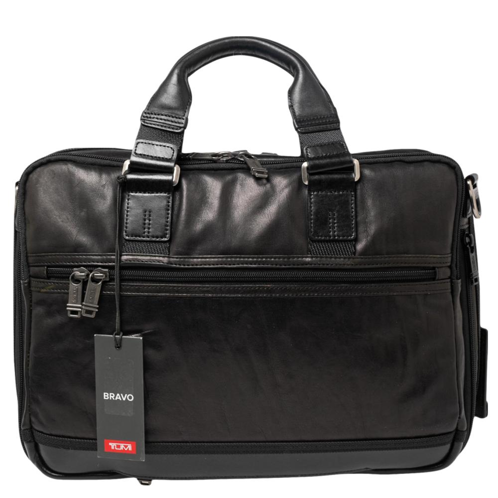 The Alpha Bravo Andersen Slim Commuter briefcase by TUMI is an ultra-functional choice to carry your essentials! Crafted using leather, the briefcase is perfect for frequent use. It includes two top handles and an adjustable shoulder strap. Aside