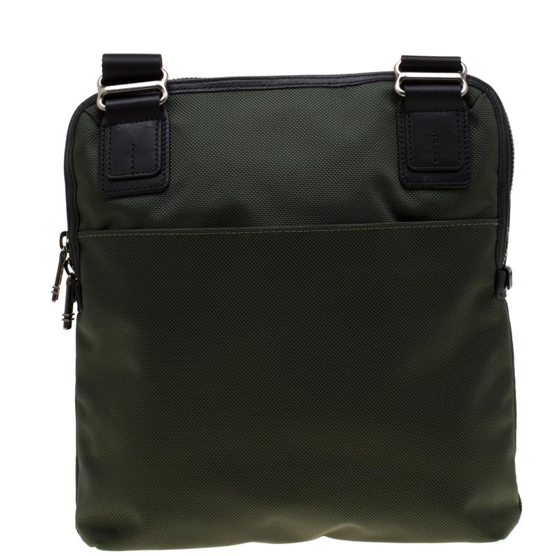 This Annapolis messenger bag from Tumi definitely needs to be on your wishlist! The olive green creation is crafted from canvas and leather and styled with an adjustable shoulder strap. It has a front flap that is detailed with a zip pocket and an