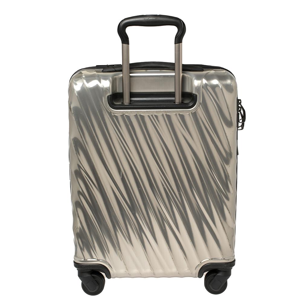 This 19 Degrees packing case from TUMI is made from silver Polycarbonate. Equipped with four wheels that offer unrestrained movement, the bag has a top carry handle along with zippers to ensure security. It boasts a nylon-lined spacious interior