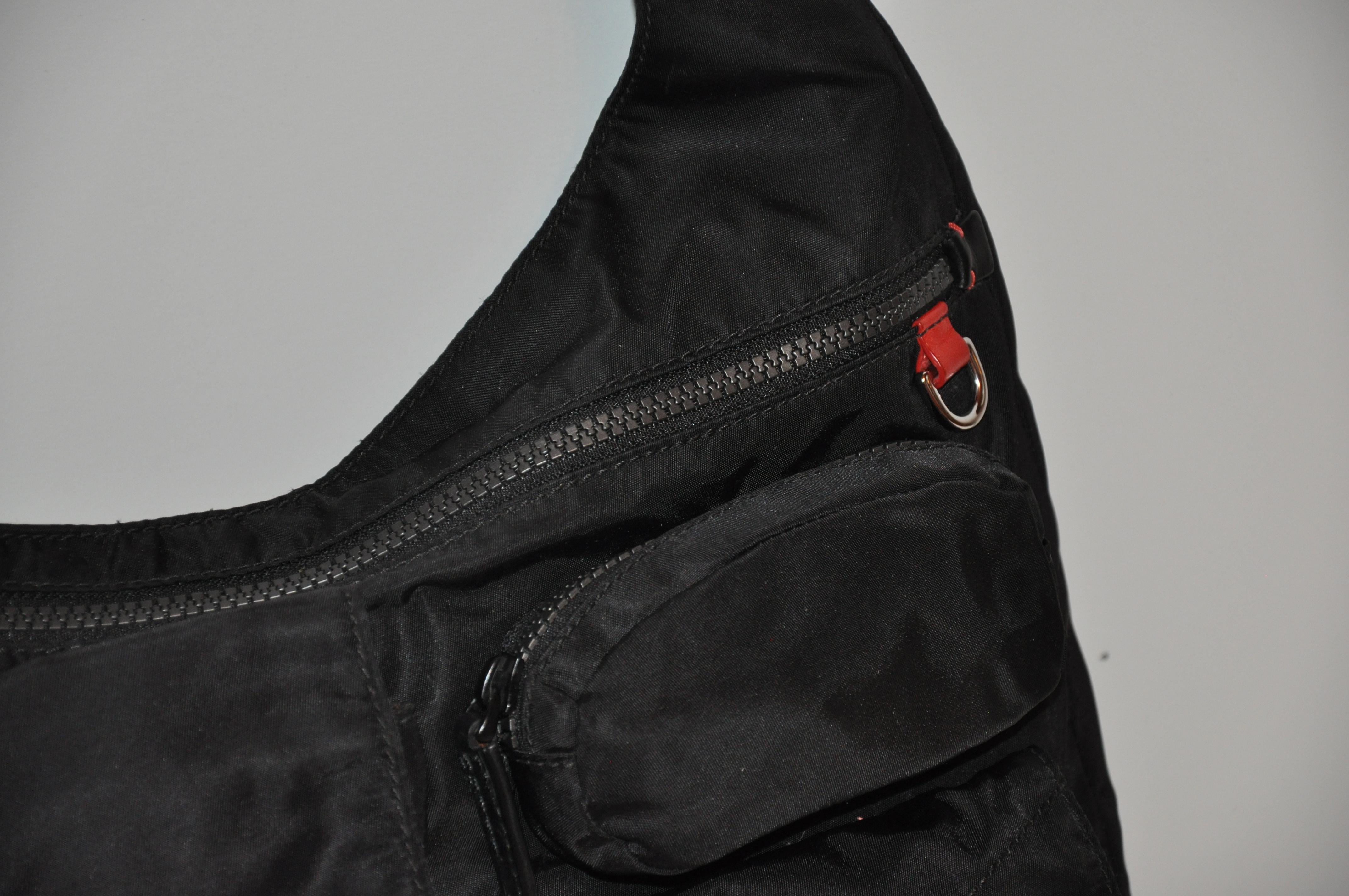 Bolso bandolera crossbody Tumi con cremallera superior y 4 compartimentos exteriores en venta 7