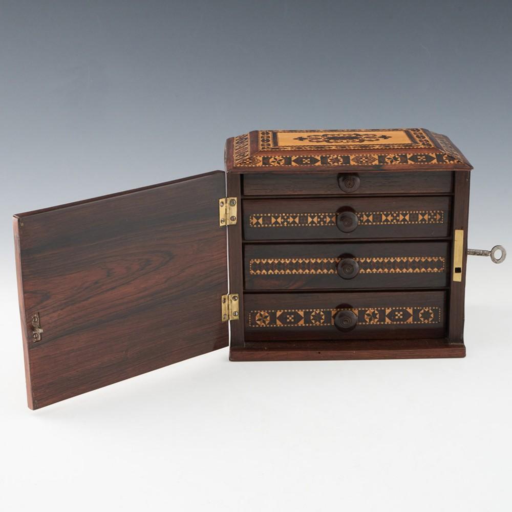 Heading : Tunbridge ware four drawer table cabinet
Date : c1860
Period : Victoria 
Origin : Tunbridge Wells, Kent
Decoration : Central abstract foliate design within angled keylines, gemoetric broder within keylines. There is geometric stickware