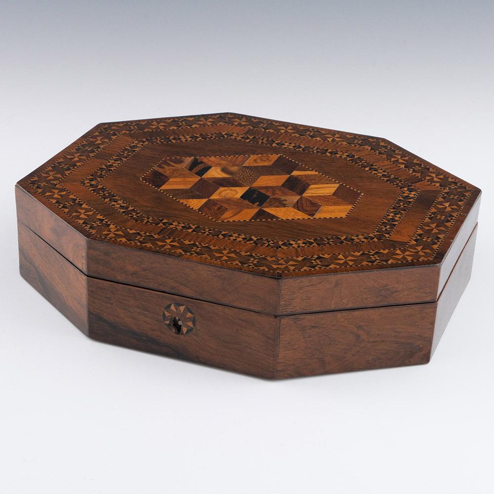 Heading : Tunbridge ware games box c1840

Date : c1840

Period : Victoria

Origin : Tonbridge or Tunbridge Wells, Kent

Decoration : Central perspective cubework within keylines. Two rows of geometric stickware within keylines to border. Internally