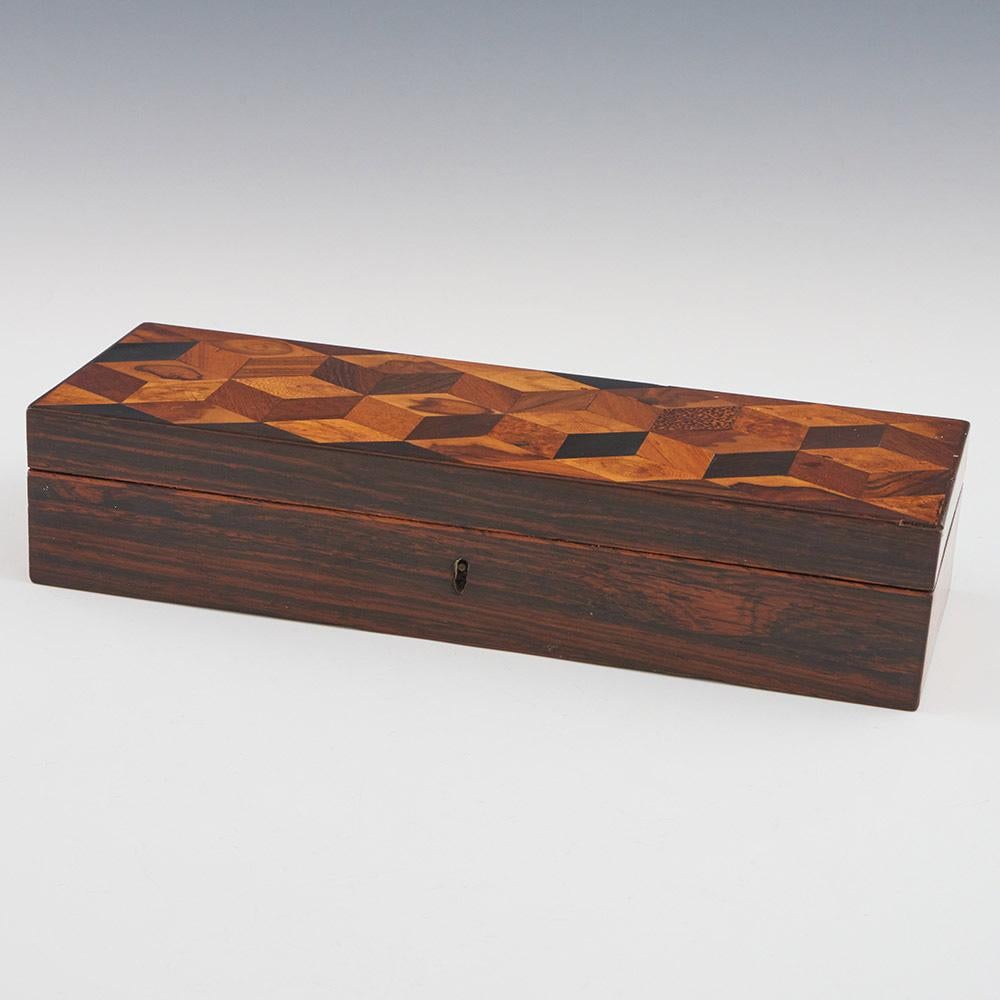 Heading : Tunbridge ware glove box wirth perspective cubes
Date : c1825
Period : George IV
Origin : Kent, either Tonbridge or Tunbridge Wells
Decoration : Perspective cube mosaic to the lid
Size :  26×9.4×5.4cm
Condition : Very good, there is a
