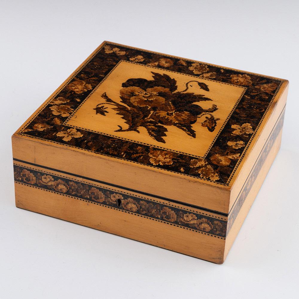 Heading : Tunbridge ware handkerchief box by George Wise c1860
Date : c1860
Period : Victoria
Origin : Tonbridge, Kent ( then Tunbridge)
Decoration : Central floral mosaic within keylines, foliate Berlin-woolwork border. Side panels with floral