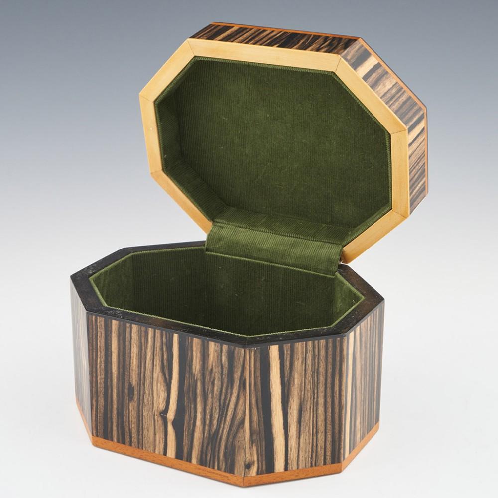 Heading : Tunbridge ware jewellery box by Robert Vorley
Date : 2022
Period : Elizabeth II
Origin : Essex
Decoration : The cover with asymetrically arranged red admiral (larger) and Orange tip butterflies within keylines. The box is made of 12
