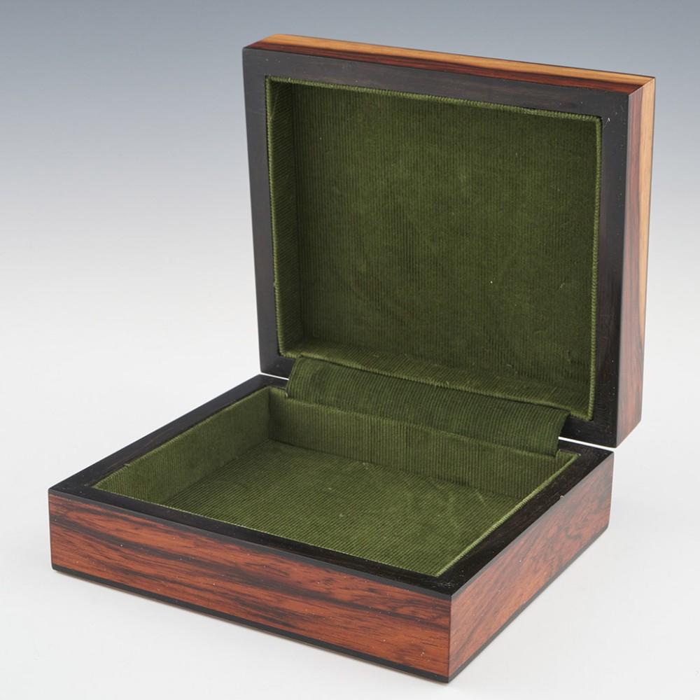 Heading : Tunbridge ware jewellery box
Date : 2023
Period : Charles III
Origin : Essex
Decoration : Central painted lady butterfly within keylines and a geometric border. The box consists of 11 different types of wood on a rosewood background.