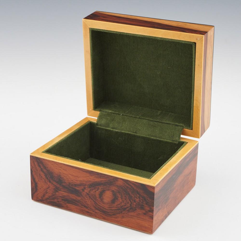 Heading : Tunbridge ware jewellery box
Date : 2023
Period : Charles III
Origin : Essex
Decoration : Central Painted Lady butterfly mosaic within keylines, geometric border. Vorley utilised 8 different types of wood on a rosewood background and more