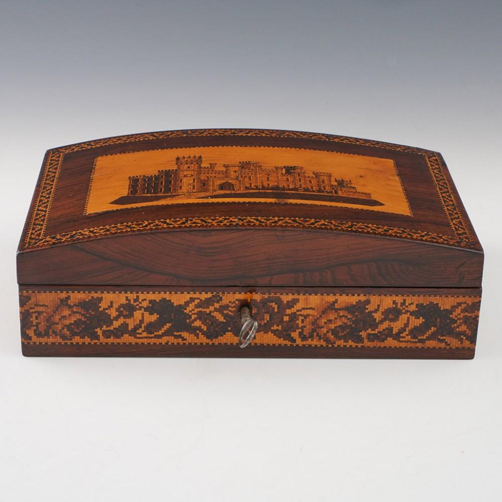 Heading : Tunbridge ware jewellery box
Date : c1850
Period : Victoria
Origin : Tunbridge Wells, Kent
Decoration : Central image of Eridge Castle within keylines. Geometric border also within keylines. Berlin woolwork floral frieze to the side