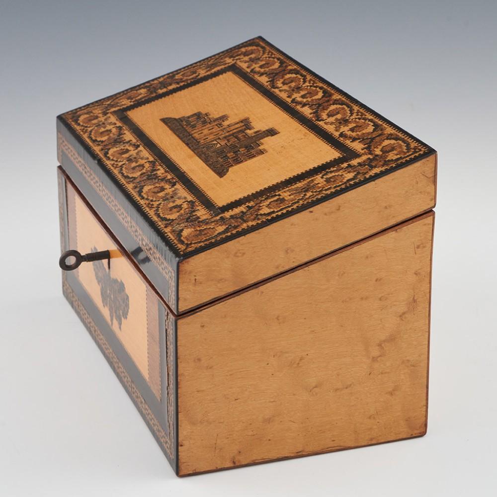 Heading : Tunbridge ware stationery box
Date : c1850
Period : Victoria
Origin : Tunbridge Wells, Kent
Decoration : Central mosic of Eridge Castle within a naturalistic border. Front panels decorated with a moth and chainlink border. Internally