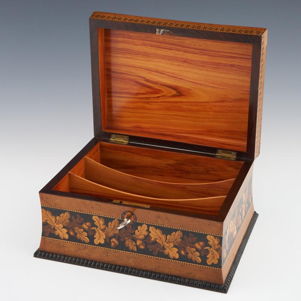 Heading : Tunbridge ware stationery box
Date : c1860
Period : Victoria
Origin : Tunbridge Wells, Kent
Decoration : Central floral mosaic set within birdseye maple with Berlin woolwork banding within keylines on pillow topped lid. Side panels