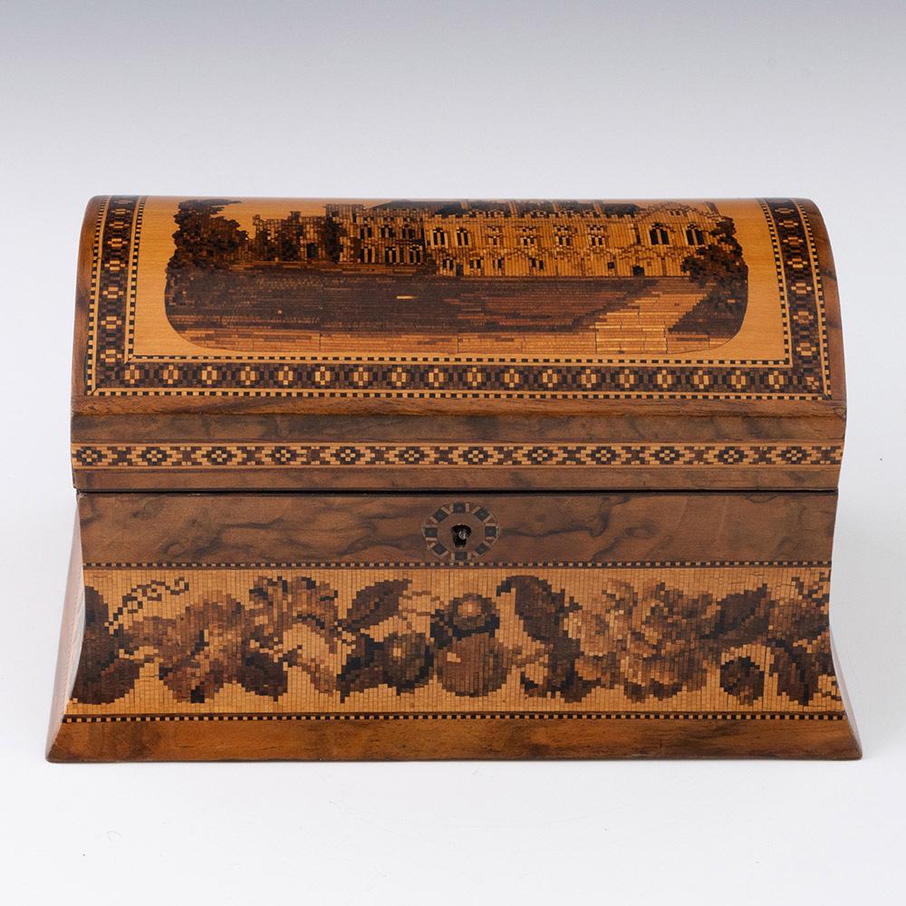 Heading : Tunbridge ware tea caddy with image of Battle Abbey cloisters

Date : c1870

Period : Victoria

Origin : Tunbridge Wells, Kent

Decoration : This example is the rarer of the two Hollamby versions of Battle Abbey. Geometric border and
