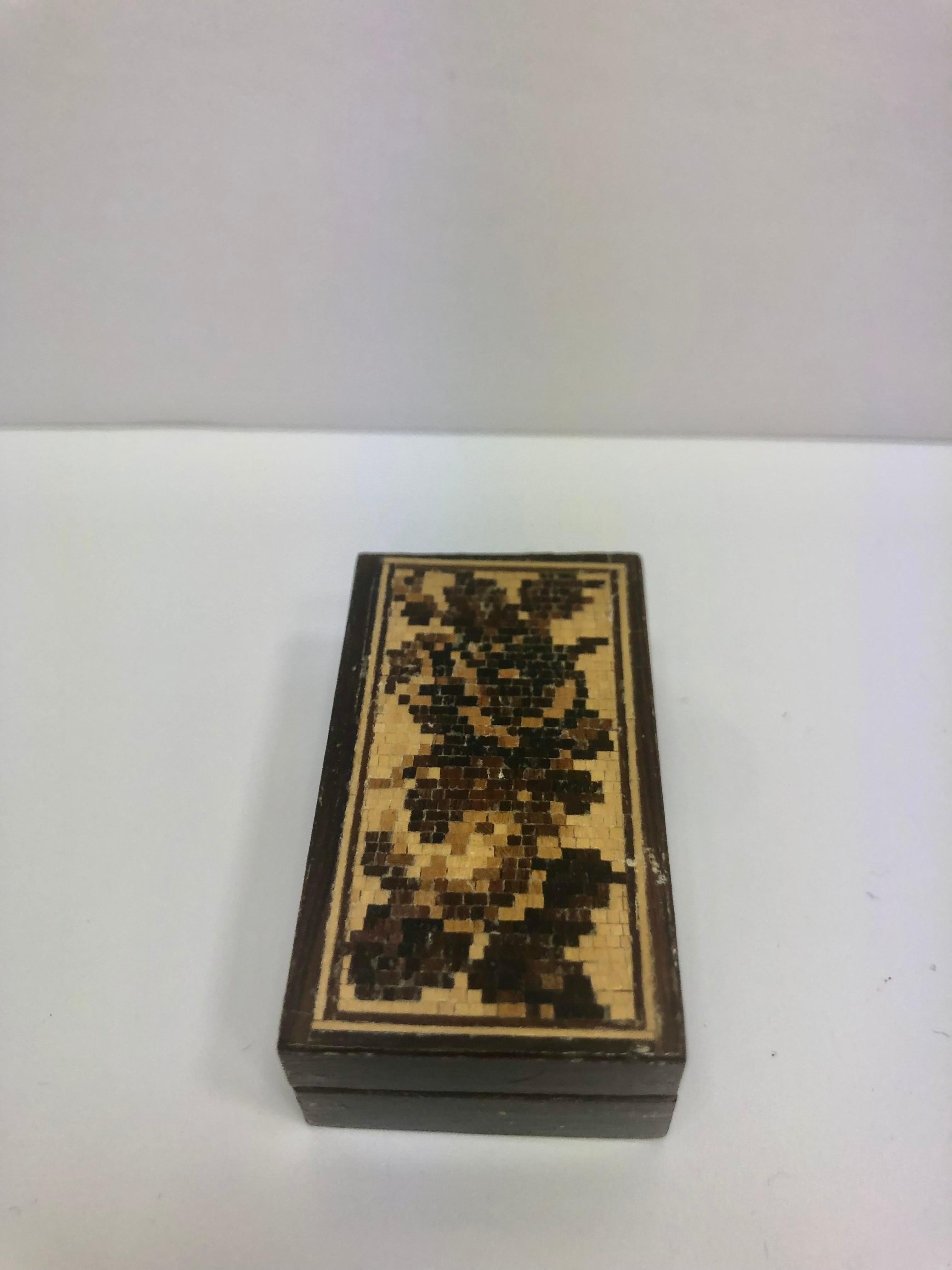 Tunbridge wooden trinket box made in England in the 1870s. Intricate floral design. Tunbridge wooden trinket box made in England in the 1870s. Tunbridge ware is a form of decoratively inlaid woodwork, typically in the form of boxes, that is