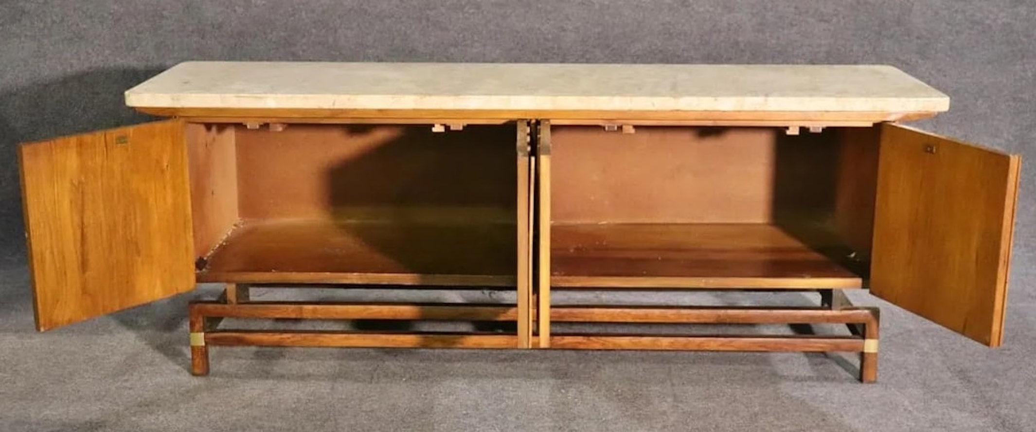 Mid-century Asian style sideboard by Hickory Furniture for their 'Tung Si' collection. Heavy marble top, two wide cabinets, floating body, brass hardware.
Please confirm location NY or NJ