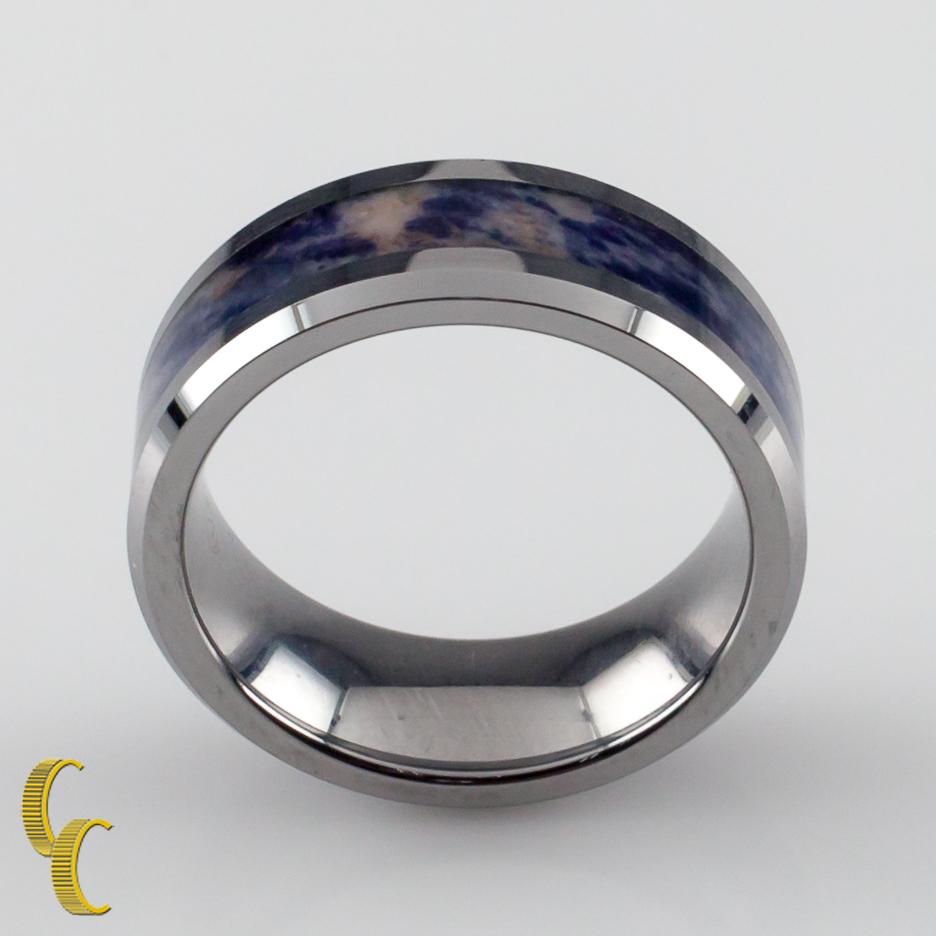 Tungsten carbide ring.
Features a center band of blue marble color.
Width: 8 mm.
Size: 8.5.
Weight: 13.3 grams.