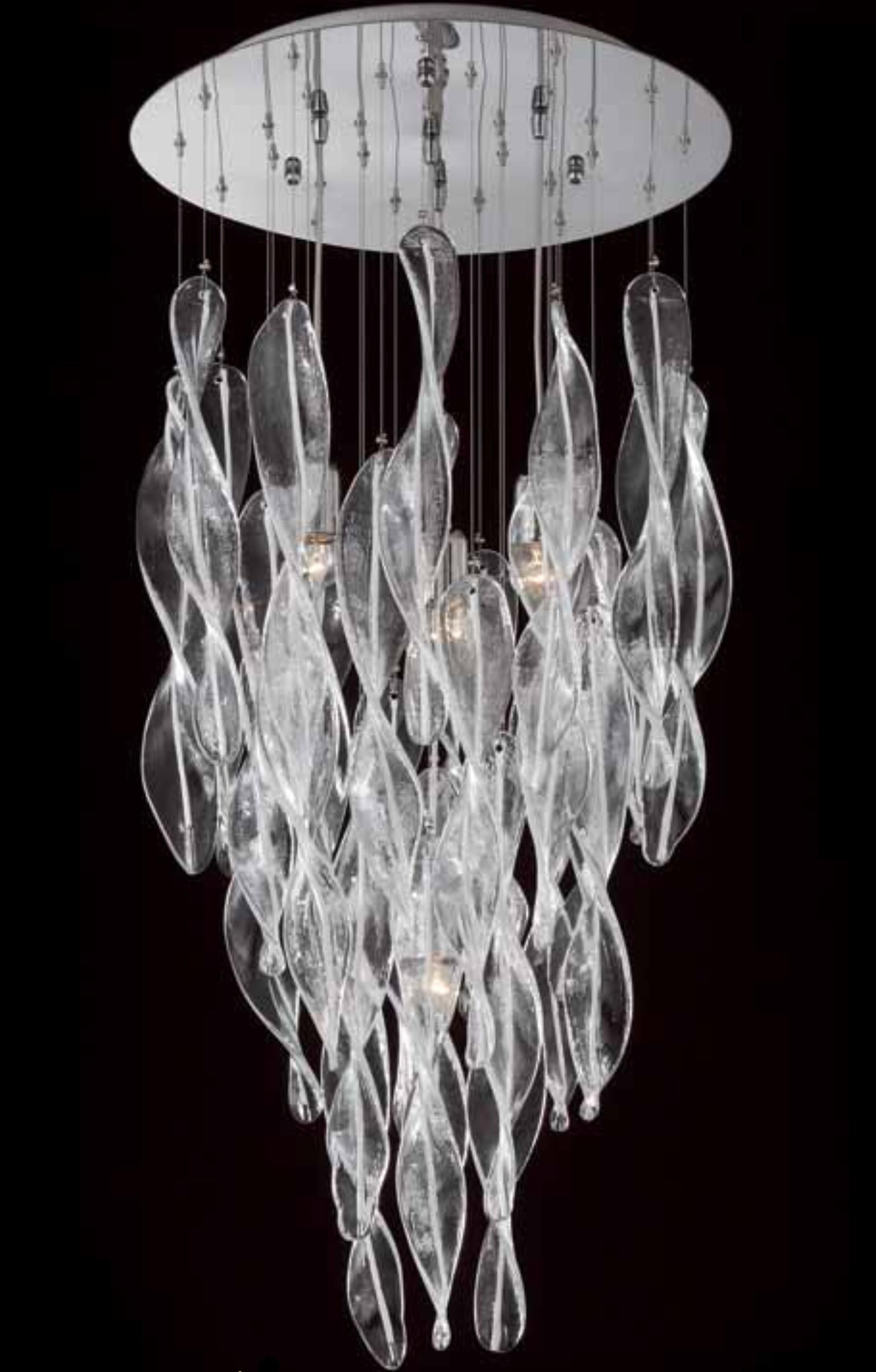 Italian flush mount shown with clear Murano glass swirls decorated with white stripes in the center, mounted on round stainless steel ceiling plate / inspired by Mazzega / Made in Italy
4 lights / E26 or E27 type / max 60W each
Measures: Diameter 20