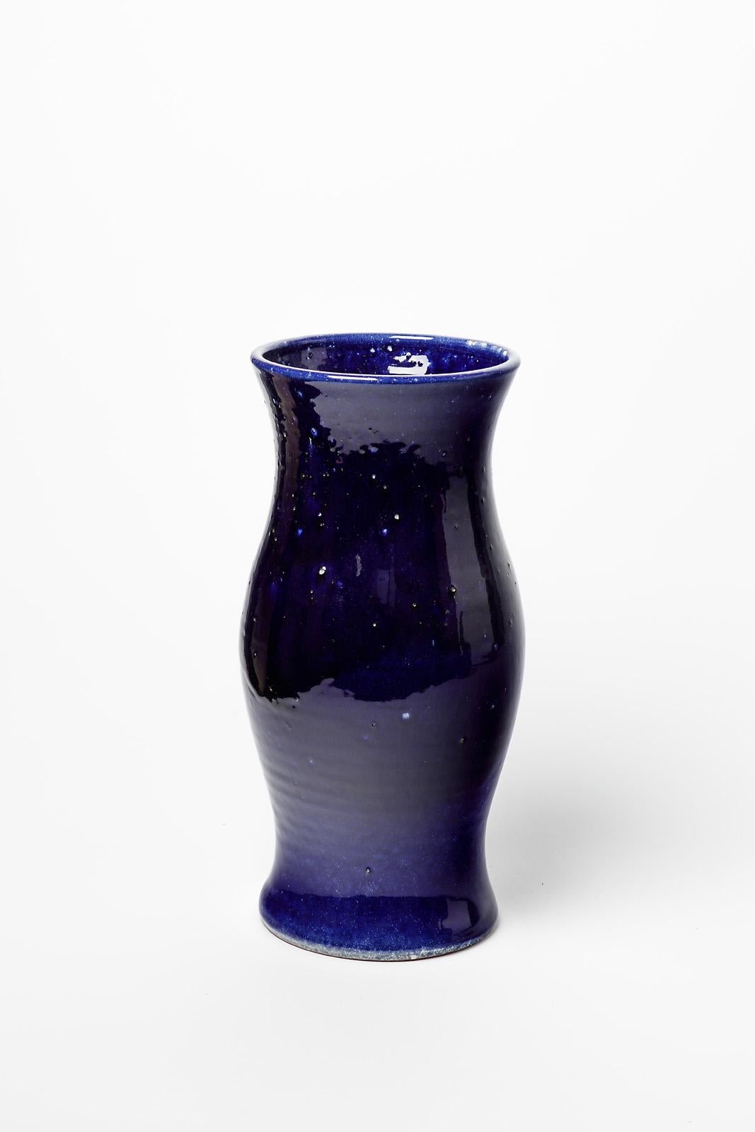 Turgis pottery.

French unique handmade piece by Turgis.

Elegant ceramic vase with dark blue ceramic glaze color.

Original perfect condition.

Signed.

height 32 cm
Large 16 cm.
