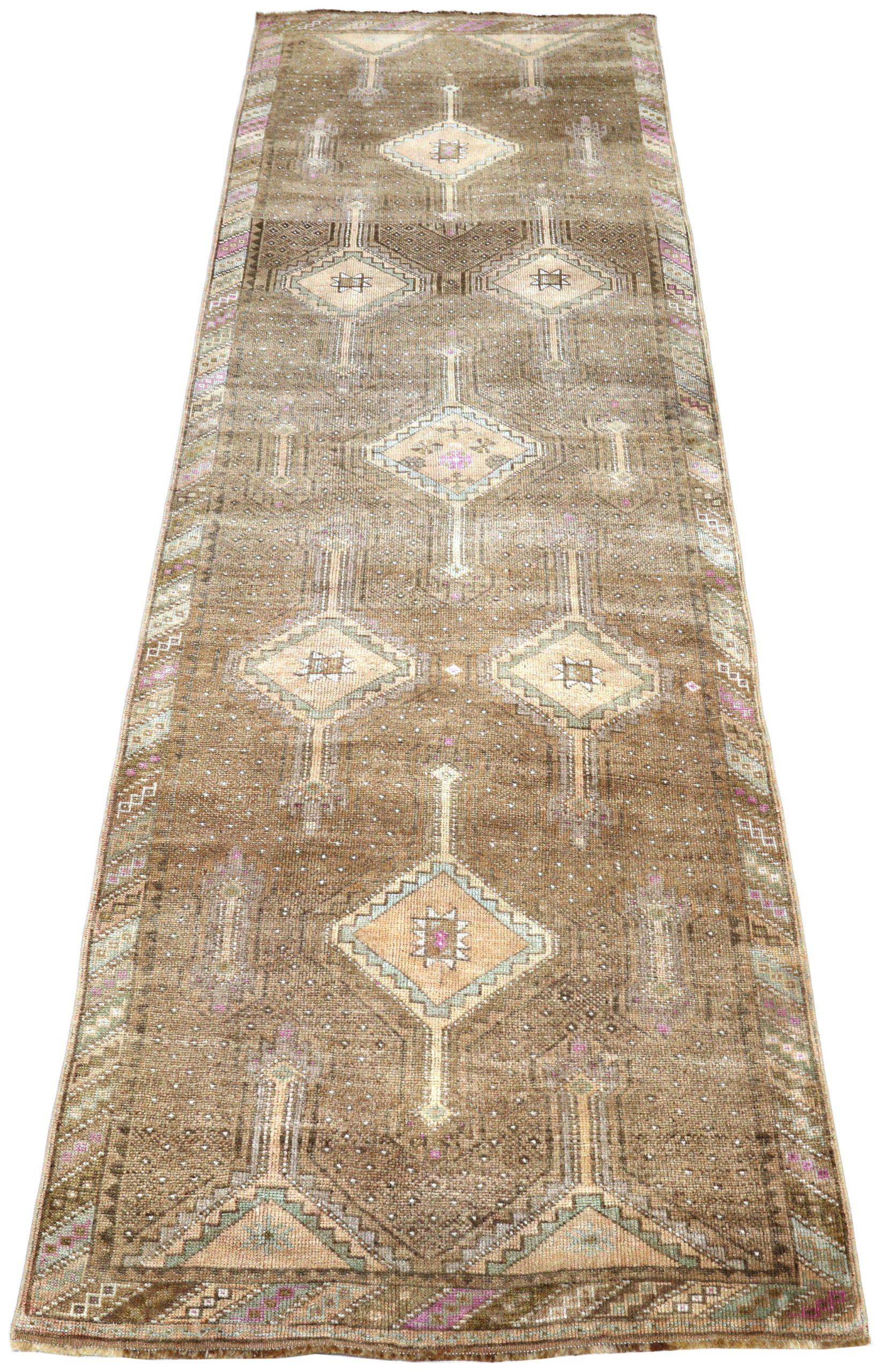 Traditional Turkish Wool Runner Rug

This extraordinary runner displays a captivating array of intricate floral patterns on a serene field. Its robust construction and subtly antique palette provide a refined, artistic pathway for any distinguished