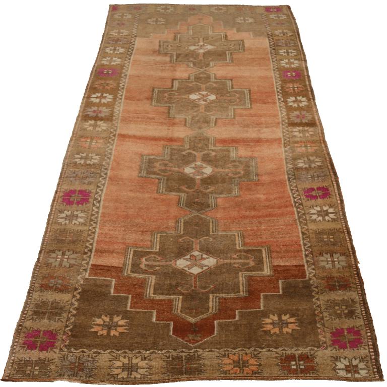 Traditional Turkish Wool Runner Rug

This extraordinary runner displays a compelling geometric narrative and robust construction, profoundly softened by an antique-washed palette. It provides a grounded and enduring artistic pathway for any