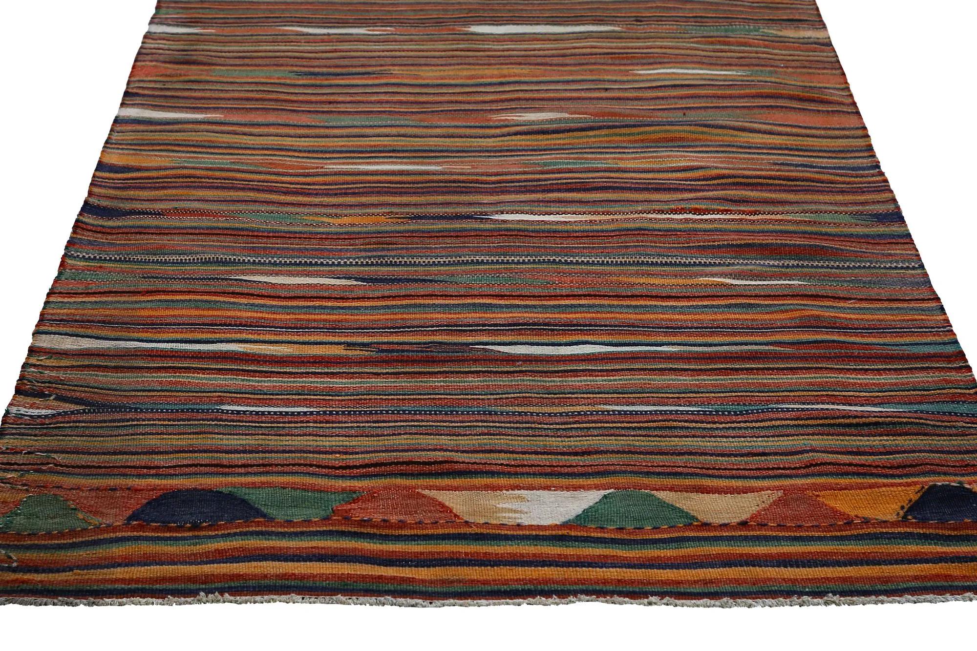 An Earth-Toned Turkish Kilim Runner
An Artistic Weave Unfolds
This magnificent Turkish Kilim runner, measuring 4 ft 6 in x 11 ft 0 in, stands as a stunning testament to centuries of celebrated Anatolian textile artistry. Its flat-woven surface