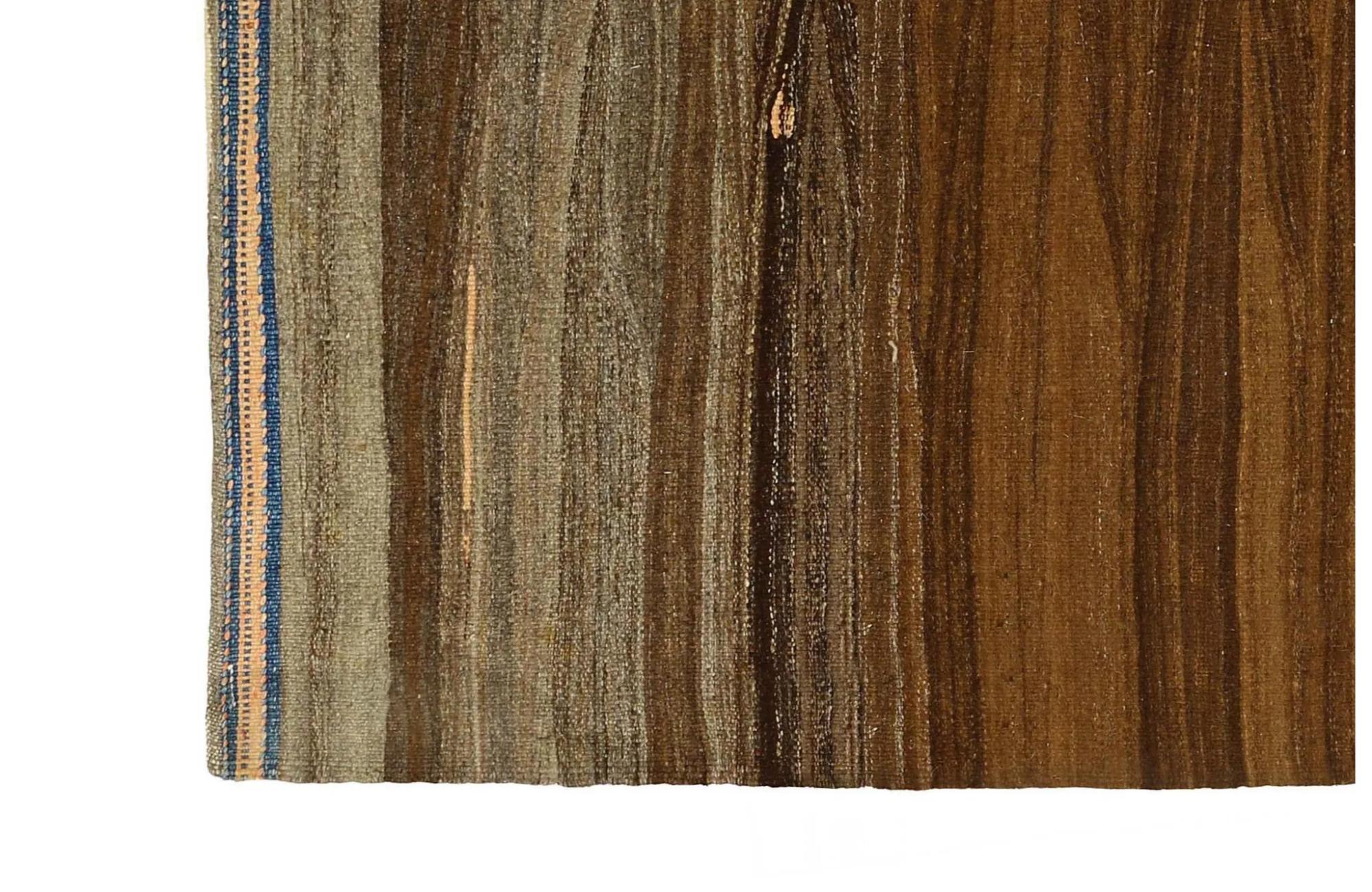 Earth's Embrace: A Serene Hand-Woven Turkish Kilim Area Rug
Bring the tranquility of natural landscapes into your home with this beautifully understated Turkish Kilim area rug. Hand-woven with meticulous care, its subtle striped design in earthy