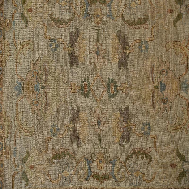 Experience Serene Sophistication: The Hand-Knotted Turkish Oushak Area Rug
Immerse your home in tranquil beauty with this exquisite Turkish Oushak area rug, a masterpiece of hand-knotted artistry that embodies timeless elegance. Renowned for their