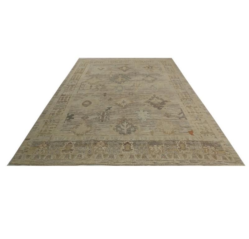 Grand Timelessness: Turkish Oushak Area Rug (161 x 193 Inches)
Unveil the quiet grandeur of our Turkish Oushak Area Rug, a masterpiece of traditional artistry infused with a gently aged aesthetic. Hailing from the historic weaving regions of Turkey,