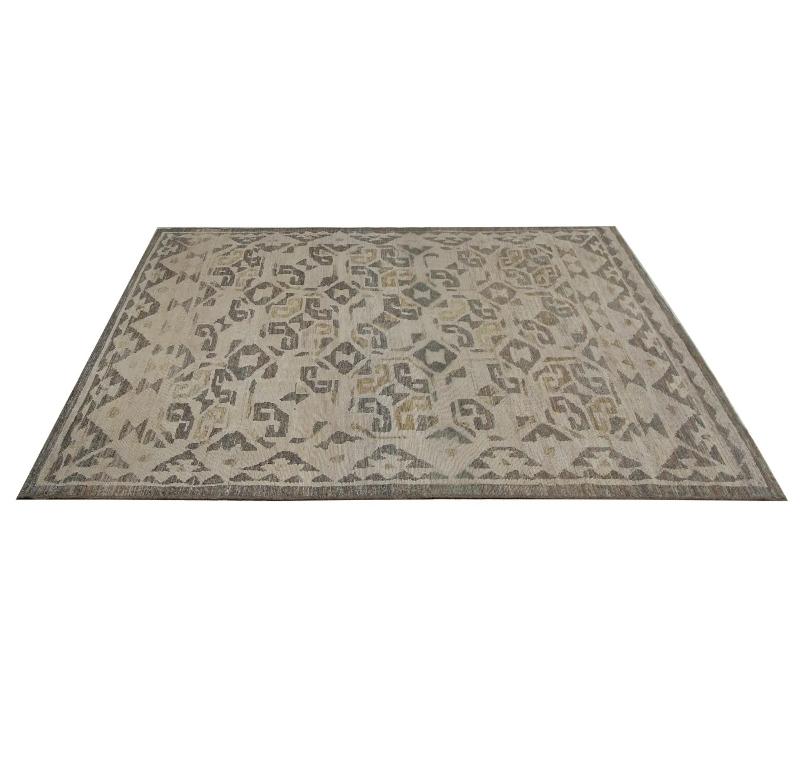 Earthy Abstract: Hand-Knotted Turkish Oushak Area Rug with Muted Tones
Embrace the understated artistry of this exquisite hand-knotted Turkish Oushak area rug. Originating from the storied weaving regions of Turkey, this rug masterfully blends