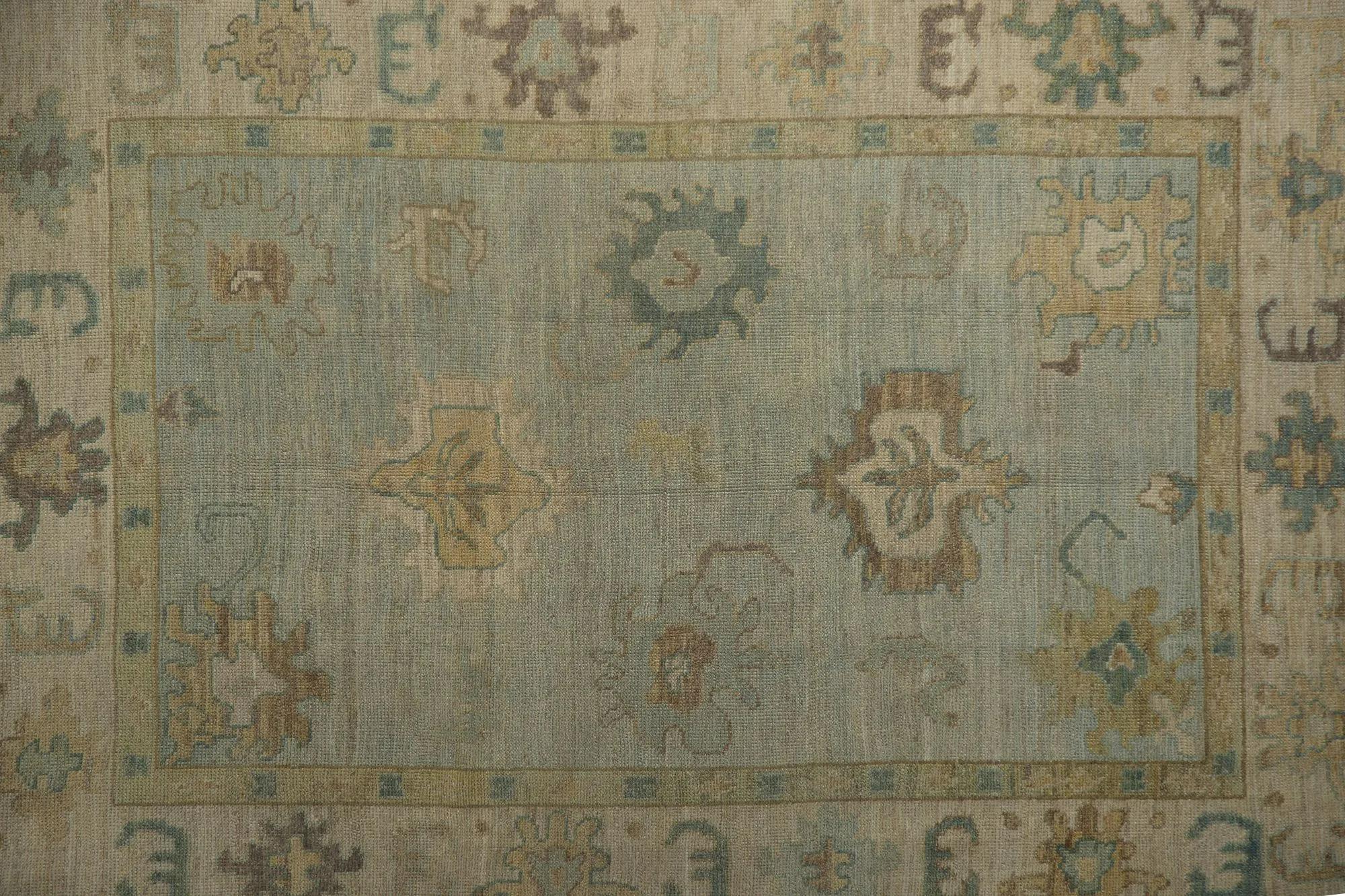 Serene Hand-Knotted Turkish Oushak Area Rug
Infuse your home with traditional elegance and a calming ambiance with this exquisite hand-knotted Turkish Oushak area rug. This piece beautifully embodies a timeless, vintage aesthetic, blending classic