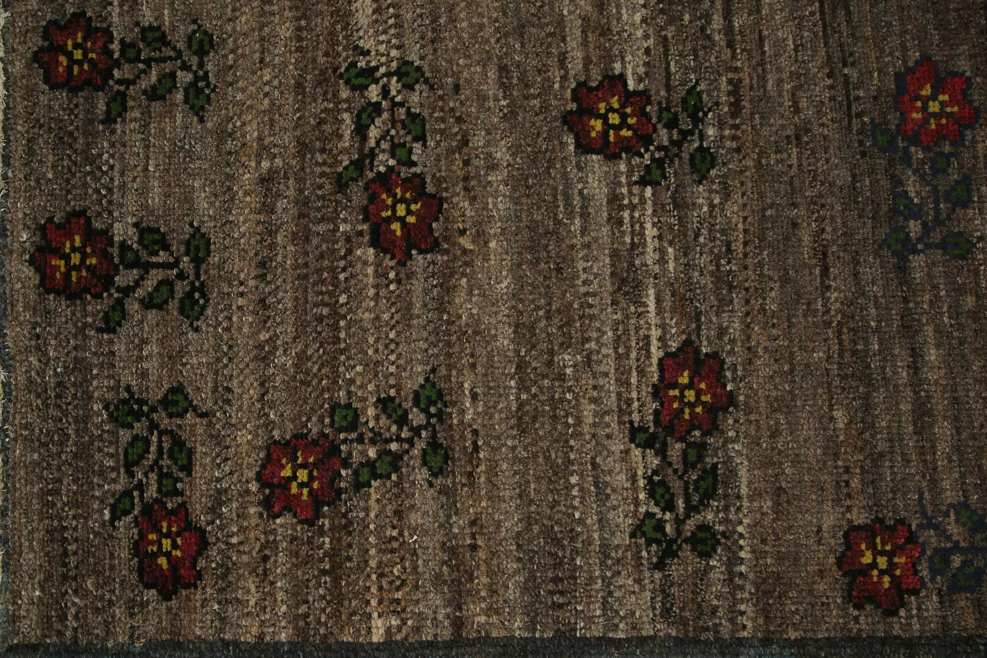 Rustic Blooms: A Charming Hand-Knotted Turkish Oushak Area Rug
Embrace the understated charm of this delightful hand-knotted Turkish Oushak area rug. Its rustic elegance, featuring charming floral motifs on a textured, earthy background, offers a