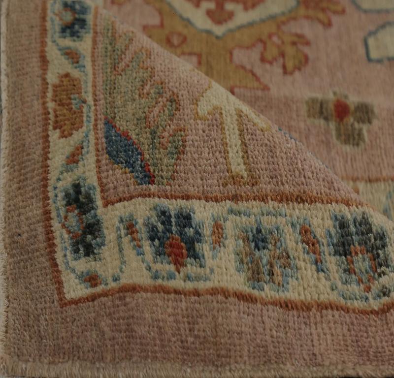 Vibrant Turkish Sultanabad Area Rug: A Dynamic Tapestry of Muted Rose and Earth-Toned Patterns

A Field of Subtle Grandeur and Artistic Resonance
This captivating Turkish Sultanabad area rug immediately commands attention. Its expansive field, in a
