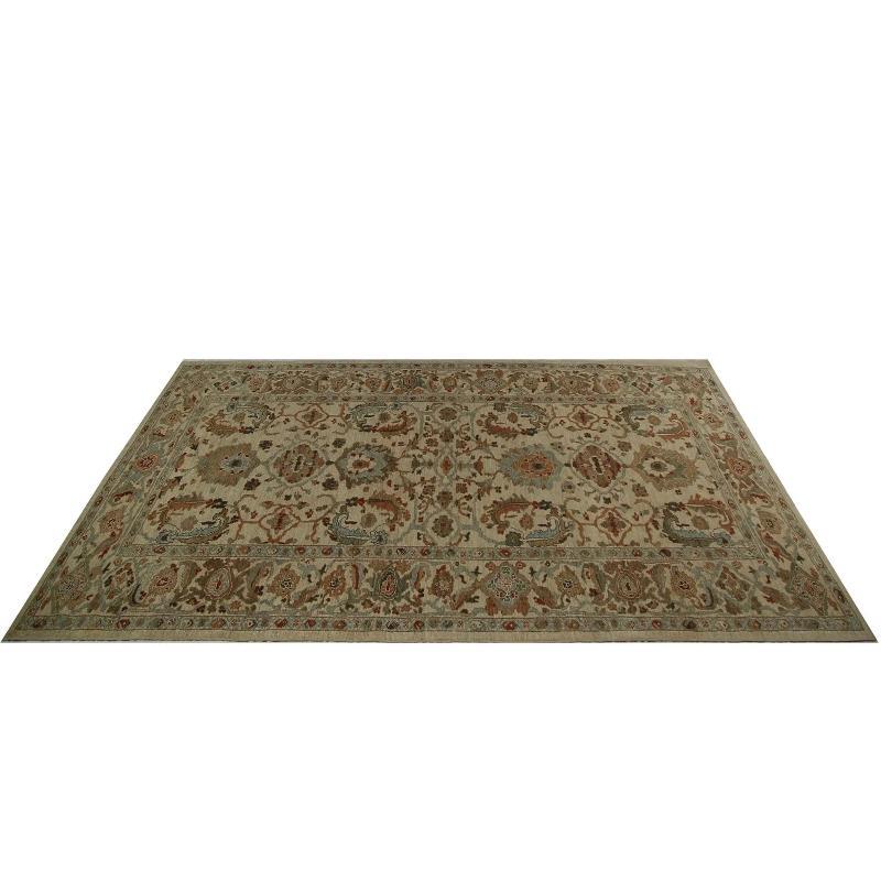 A Hand-Knotted Neutral Turkish Sultanabad Area Rug
Step into a realm of sophisticated charm with this exquisite Turkish Sultanabad area rug. Hand-knotted by skilled artisans, this piece showcases a classic design and a serene, inviting palette. It