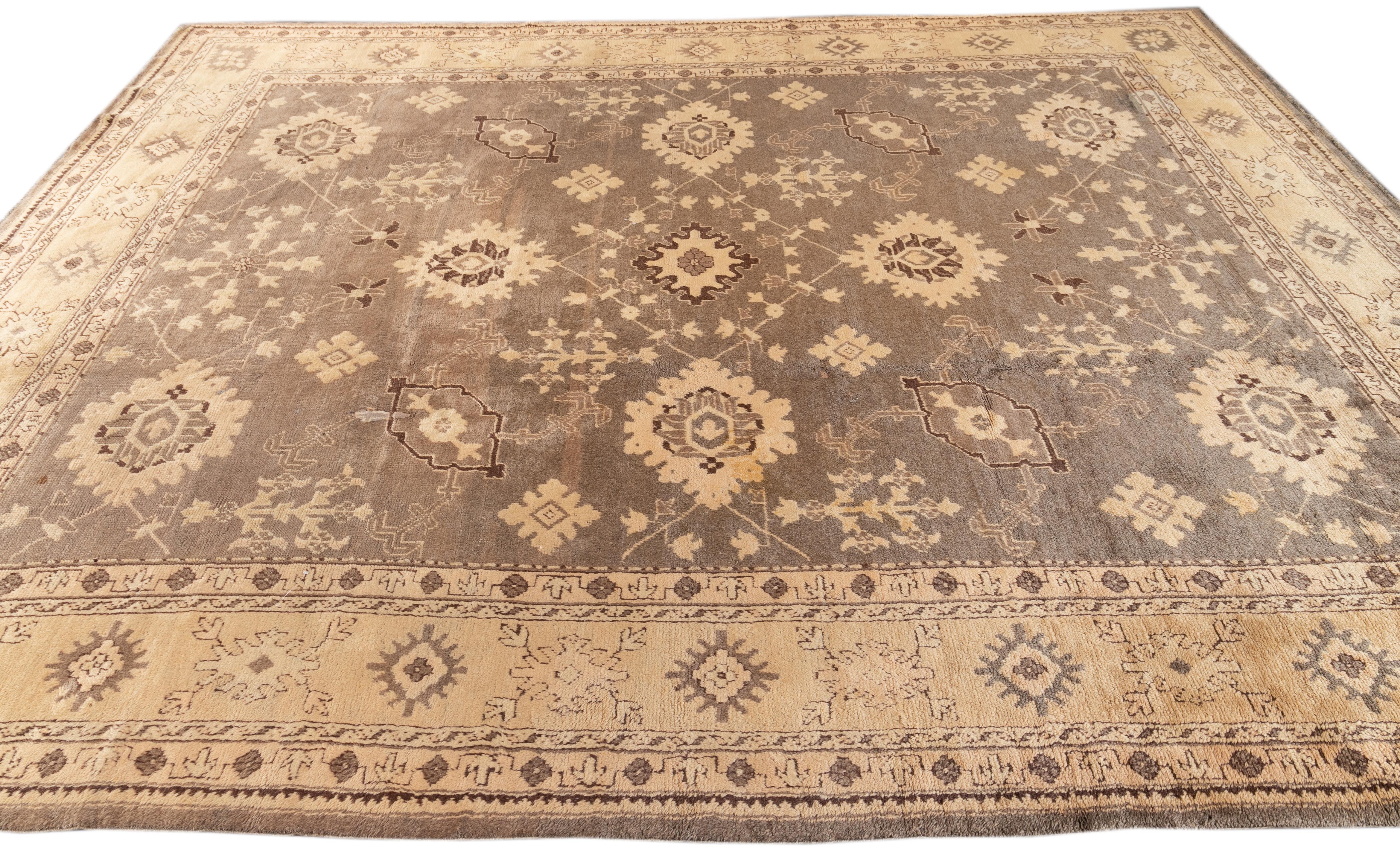 This exceptional antique Style Turkish wool rug features a charming gray color base and is hand-knotted with utmost attention to detail. With stunning beige-tan accents, it displays a captivating floral pattern that is alluring to any décor.

This