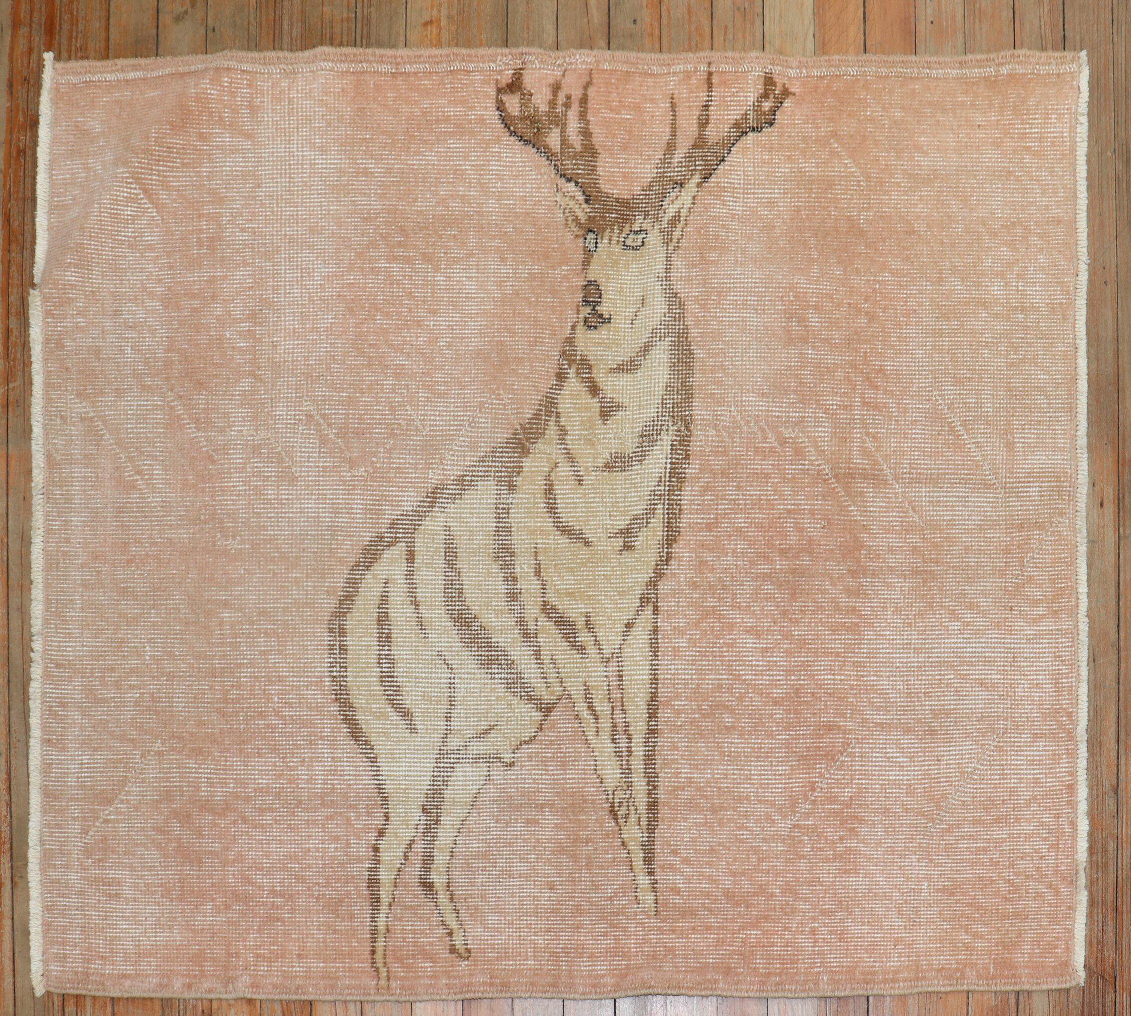 One of a kind hand-knotted Turkish Anatolian rug with stand-alone deer on a blush color ground

Measures: 3'3” x 3'11”.

